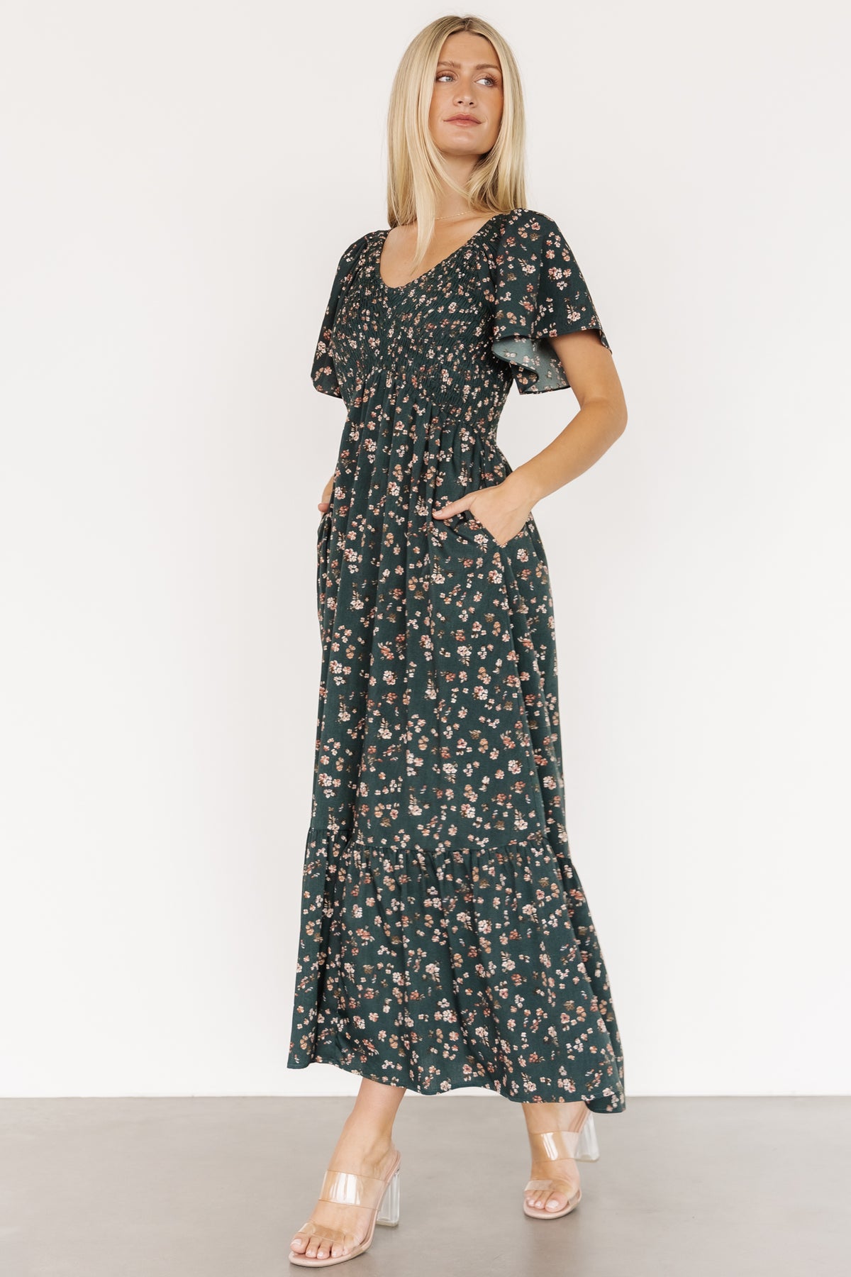 Detail image focusing on the hidden pocket and skirt tier, showing how the dress balances practical features with feminine design.