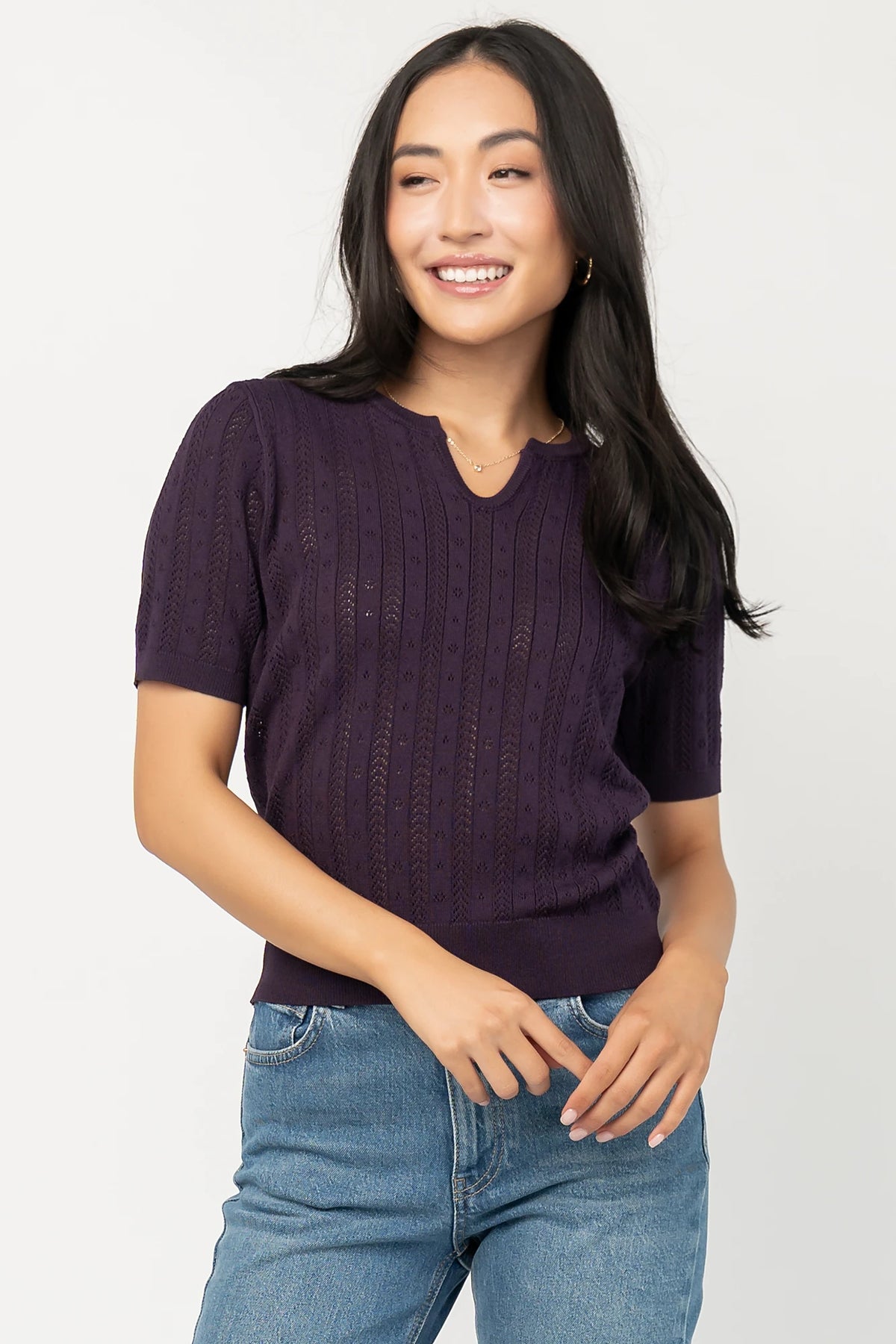 Perry Knit Top in Plum with pointelle texture, notched crew neckline, short sleeves, and ribbed hem and cuffs.