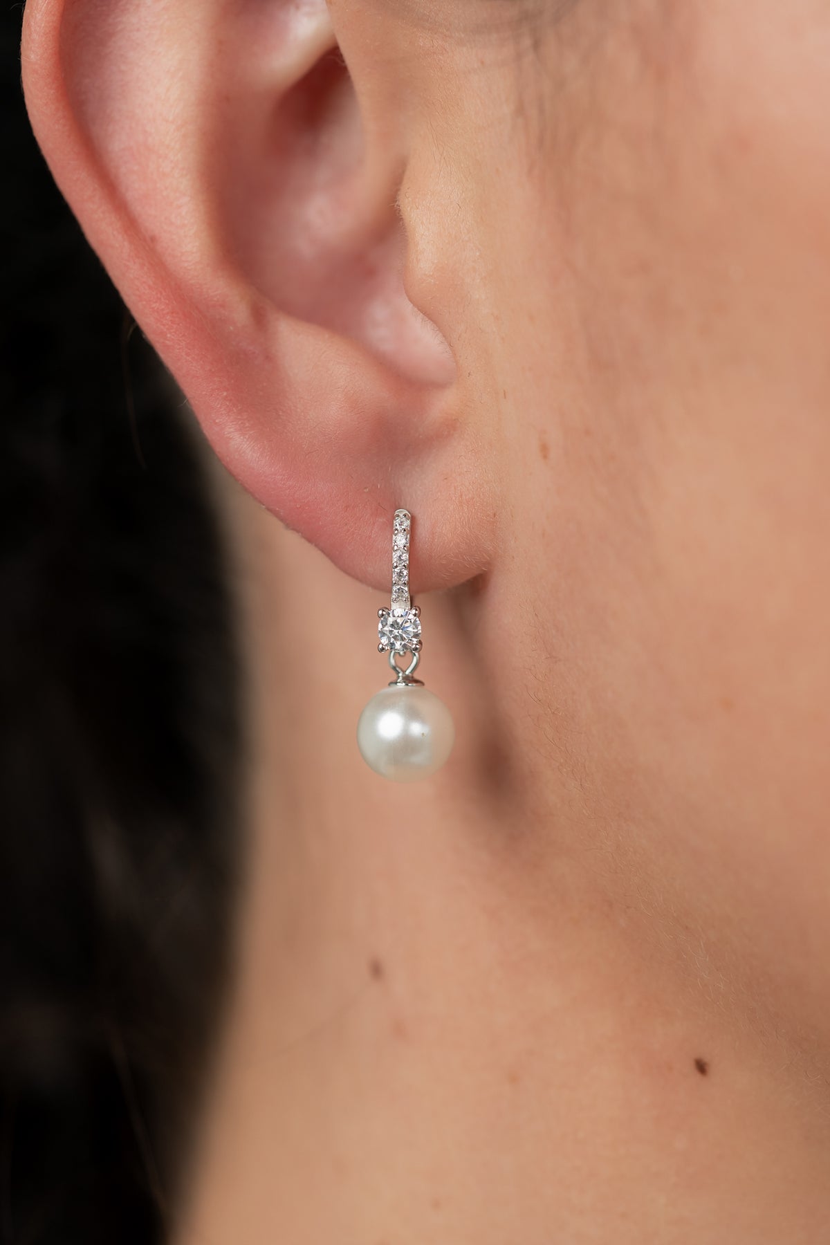 Isabella Pearl Hoop Earrings with cultured pearl accents and polished sterling silver hoops.