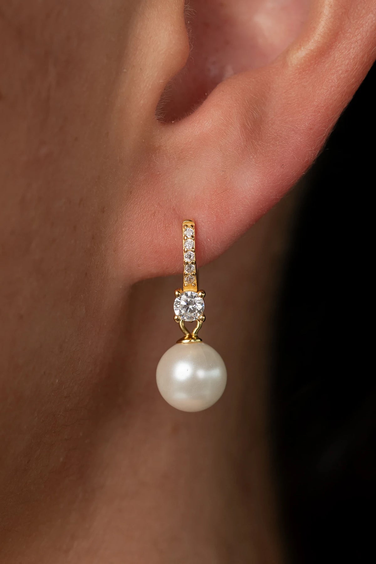 Isabella Pearl Hoop Earrings with lustrous pearl accents and a polished gold-plated finish.