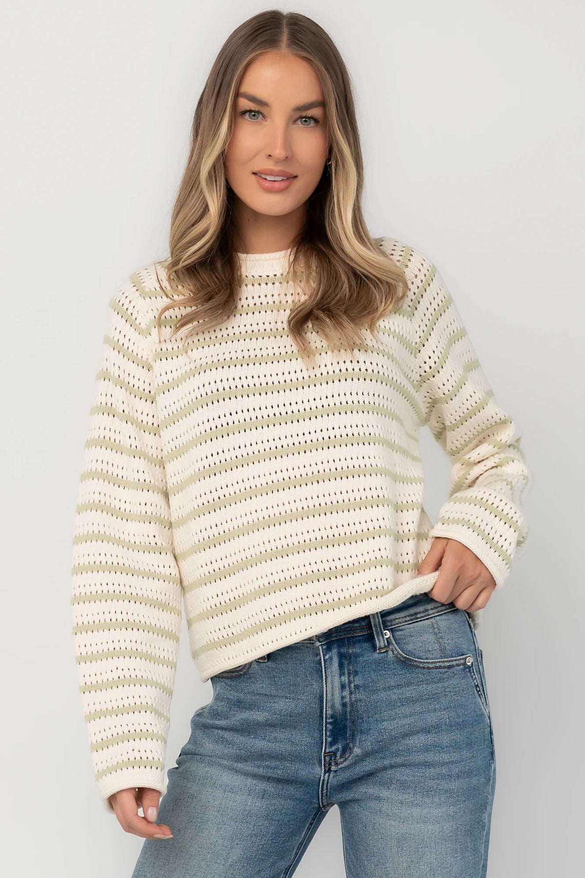 Cream and sage striped open-knit sweater with a round neckline, long sleeves, rolled trim, and a relaxed fit.