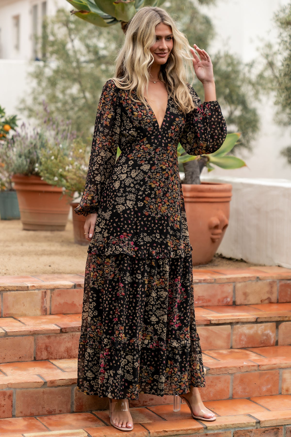 Bowman Deep V Tiered Maxi Dress in Black Multi with deep V-neck, long sleeves, ruffle-tiered skirt, and leg slit.