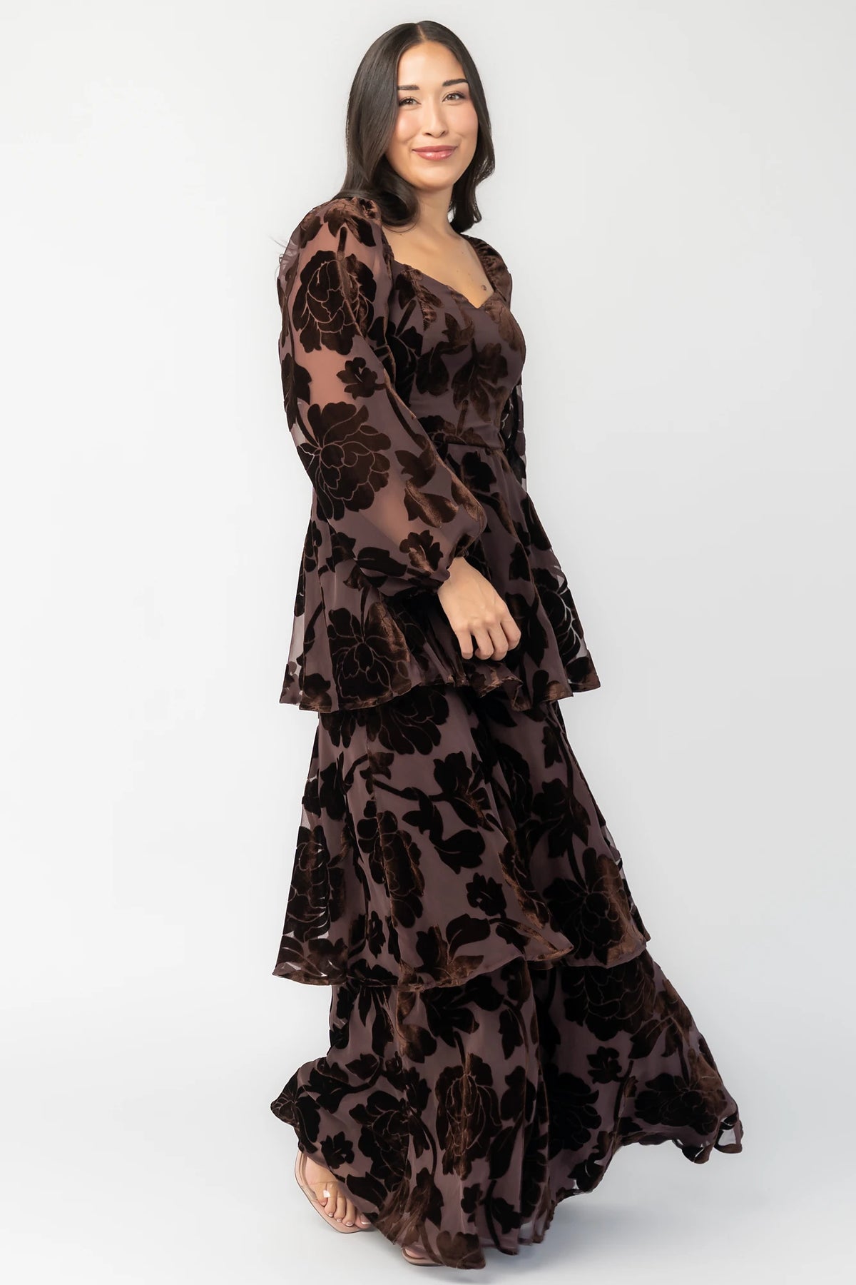 Alexandra Velvet Maxi Dress in Dark Brown with velvet florals, sweetheart neckline, long sleeves, smocked back, and flowing skirt.