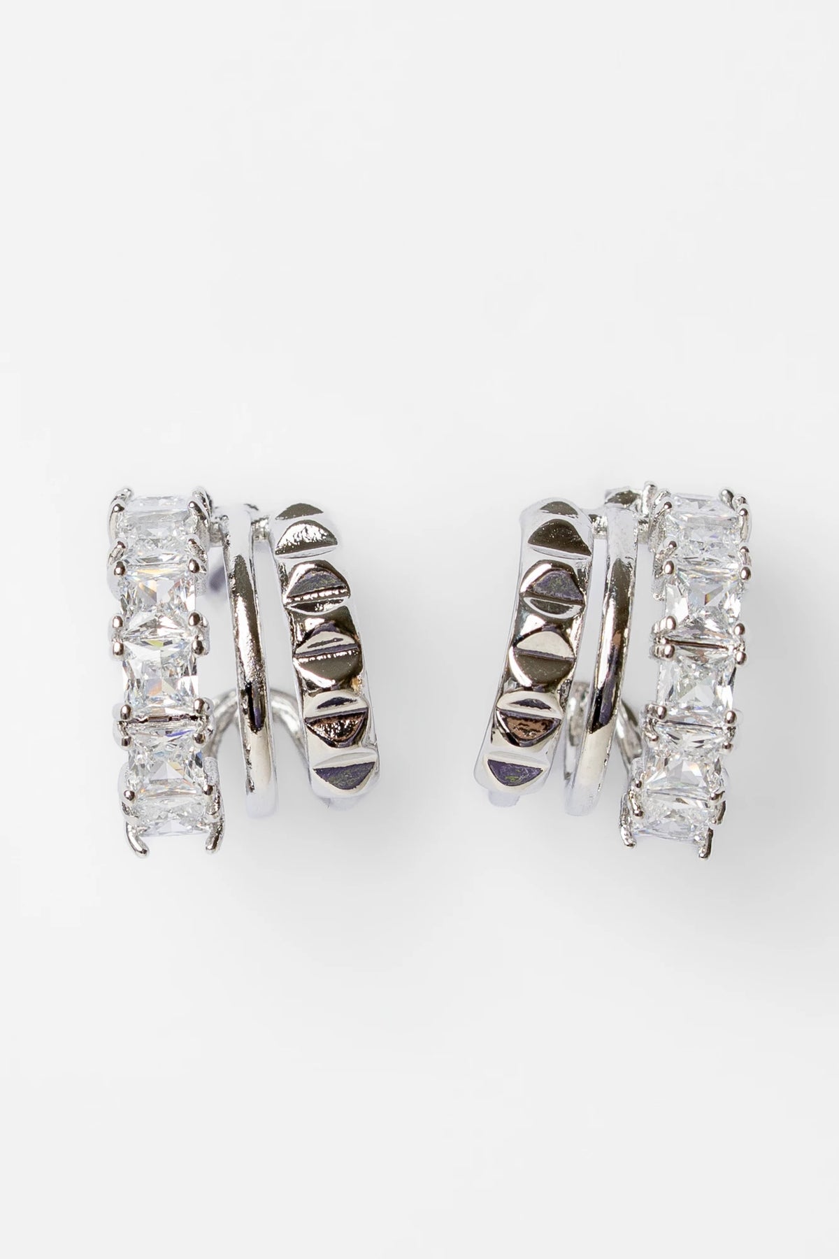 Ali Stacked Huggie Hoops in Silver with stacked design and cubic zirconia accents.