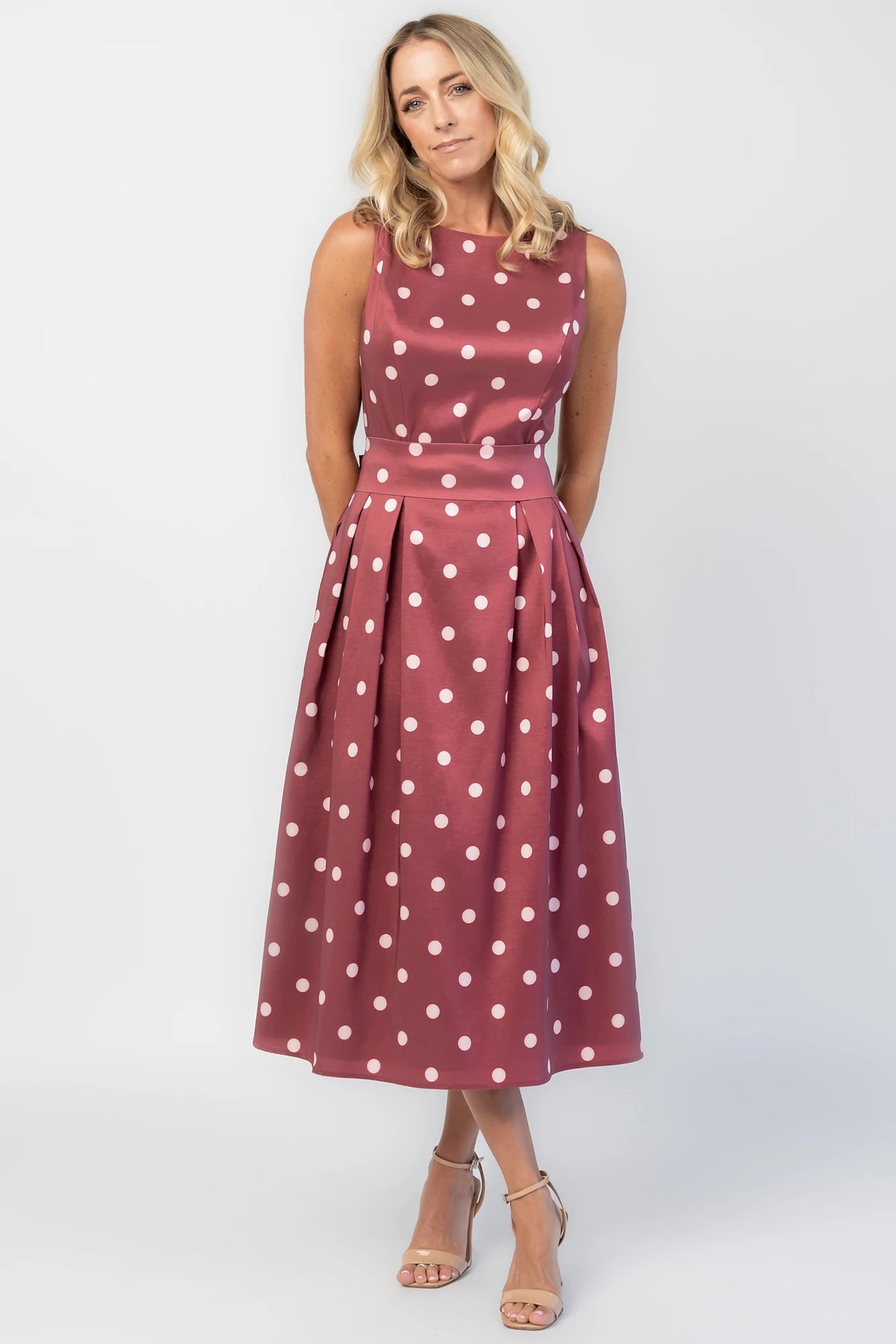 Chiara Midi Dress in Wine + Pink Dot with a boat neckline, pleated full skirt, and a fitted sleeveless bodice.