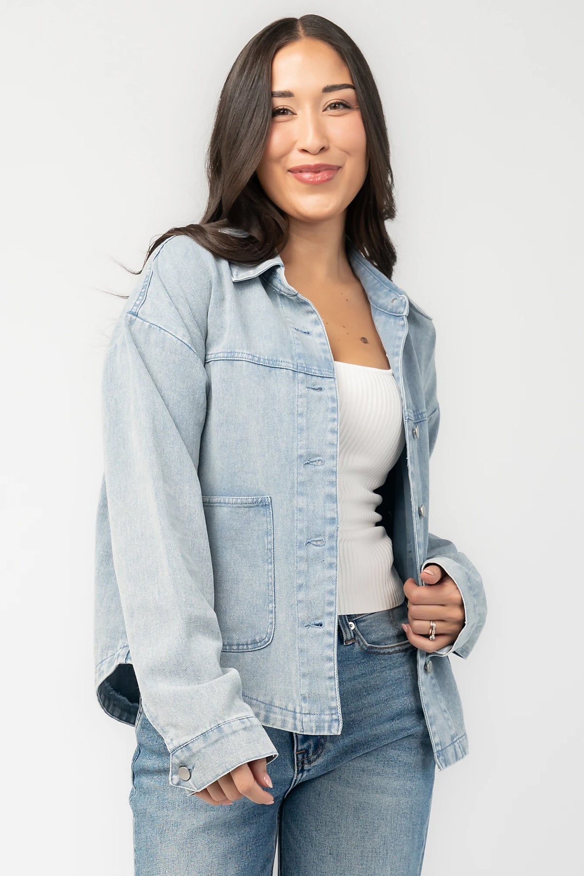 Finn Lightweight Jacket in Vintage Blue with button front, classic collar, front pockets, and shirttail hem.