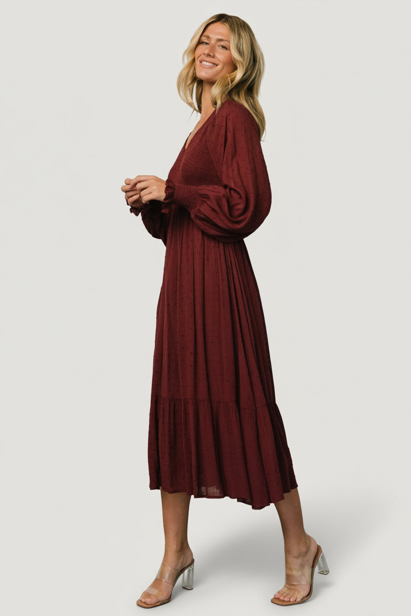 Styled look of Lainey mulberry midi dress paired with accessories, highlighting long sleeves, relaxed fit, and versatile day-to-night styling.