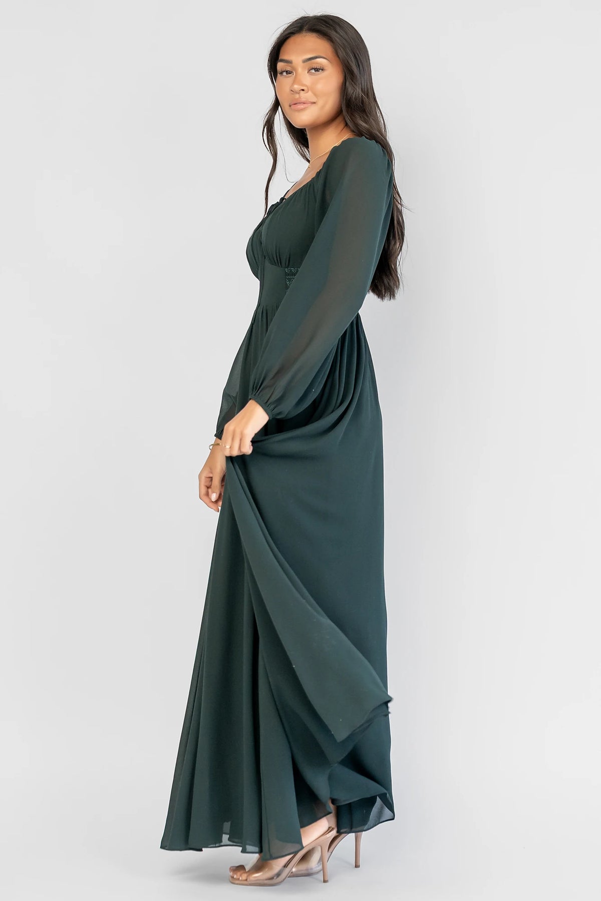Maddalena Maxi Dress in Dark Green with a sweetheart neckline, embroidered chevron detailing, and long sheer sleeves.