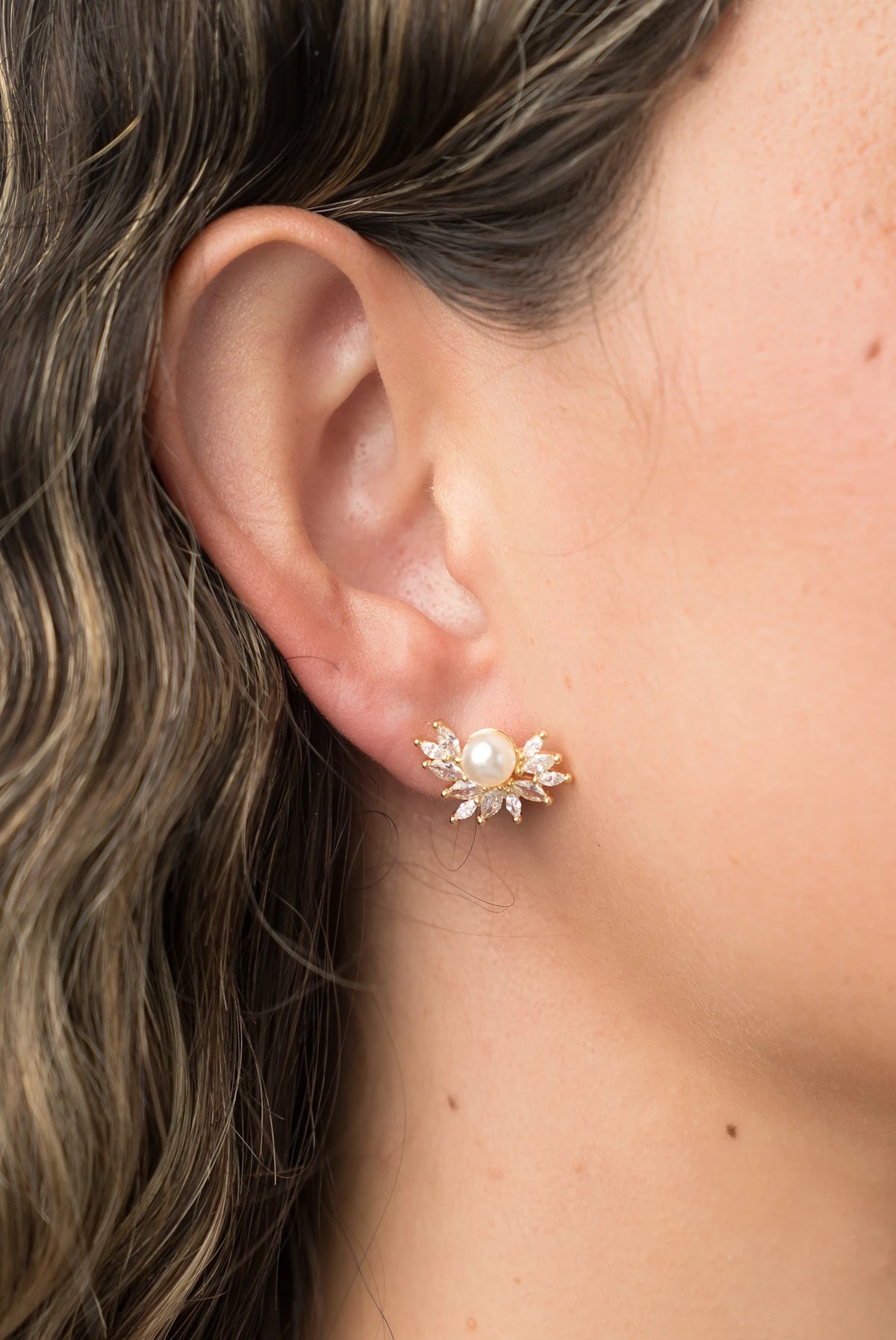 Maryana Pearl Statement Stud Earrings in Gold with marquise-cut cubic zirconia and faux pearl center.