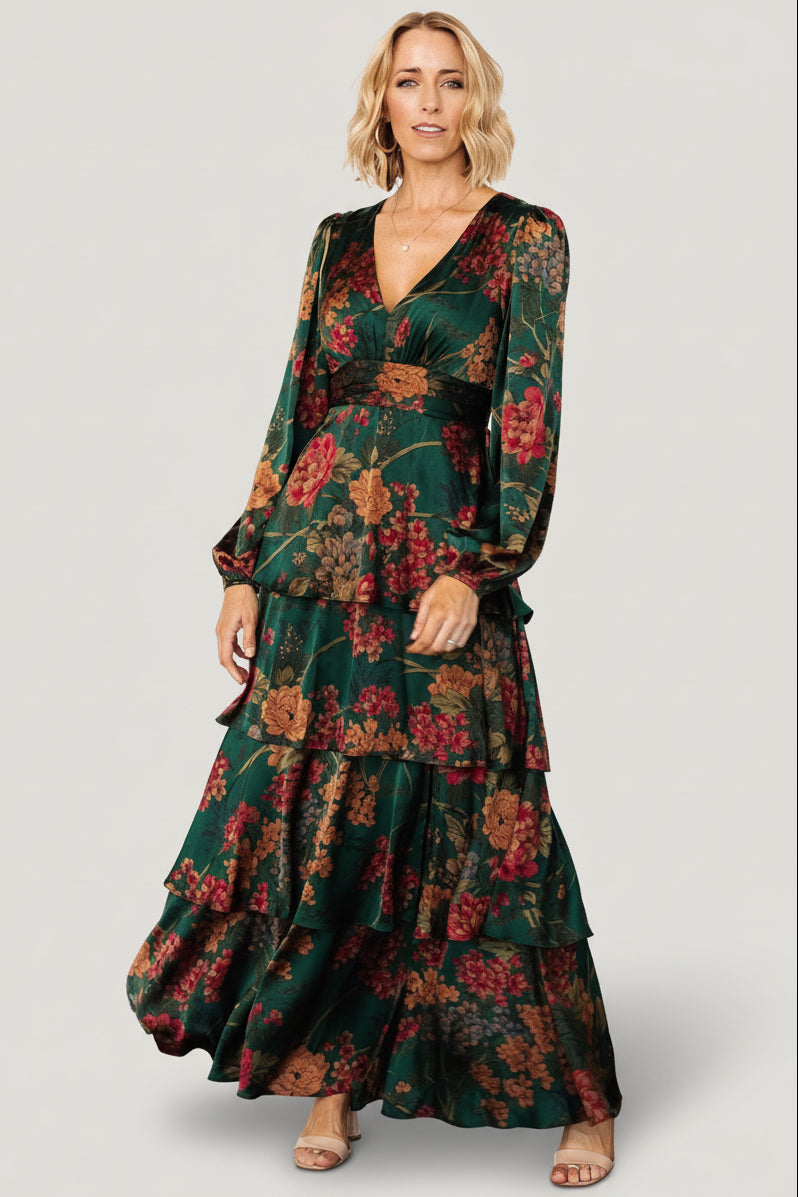 Detail view of neckline and contouring under-bust panel on emerald floral satin dress illustrating the v-neck shape and seam placement.