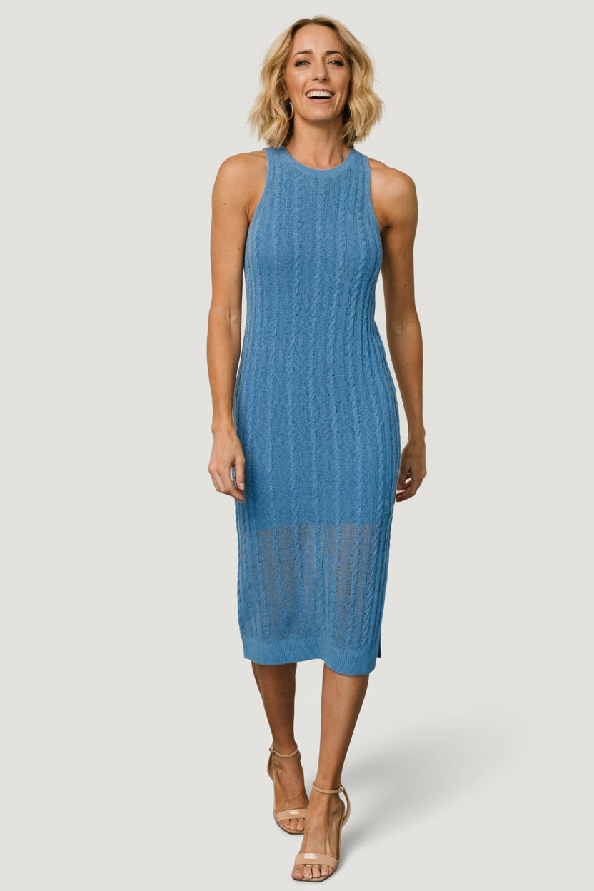 Styled outfit of the Nalani blue knit midi paired with casual shoes, showing versatility for both day and evening looks.