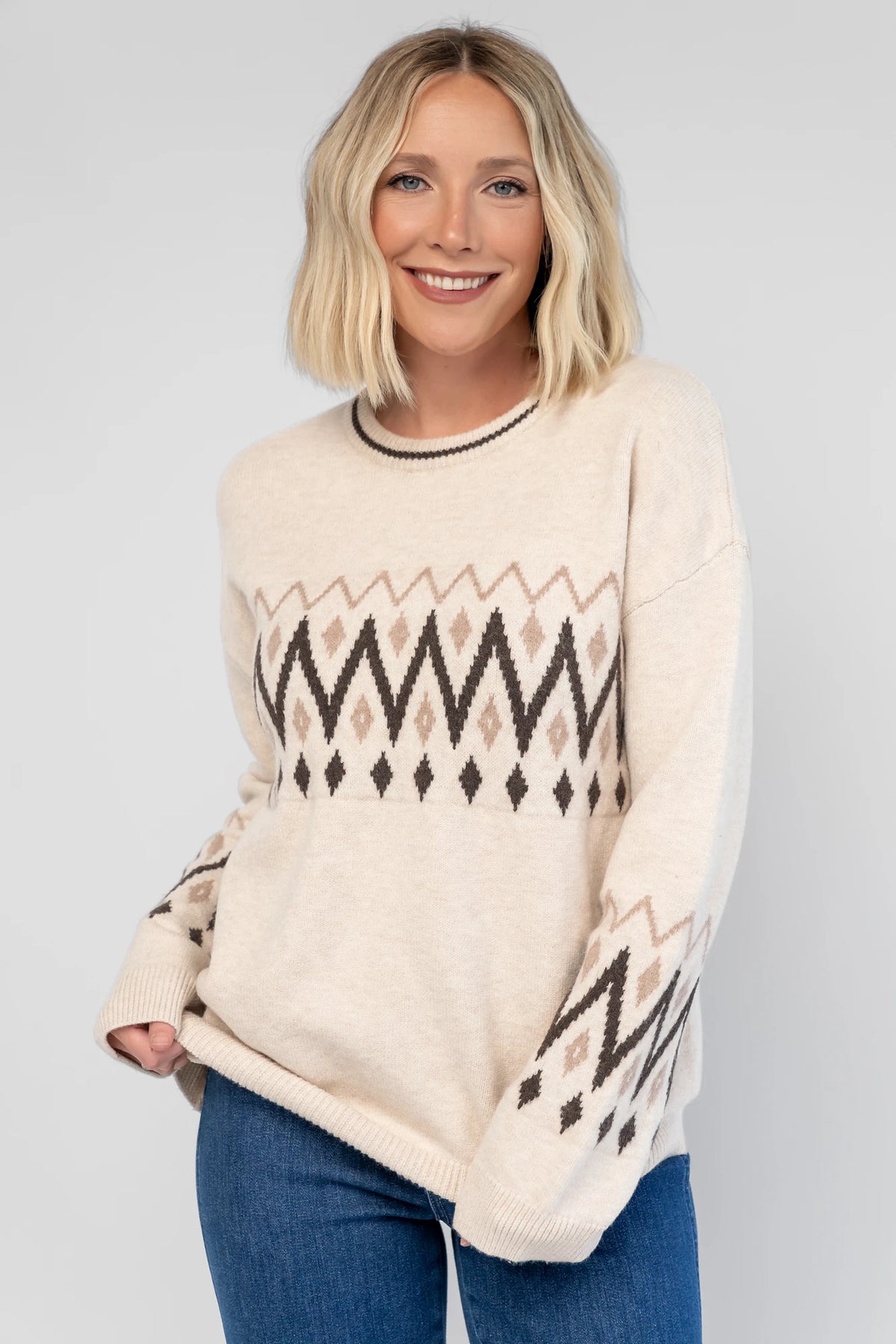 Oona Sweater in Natural with a buttery-soft knit, Fair Isle print, round neckline, and relaxed dropped-shoulder fit.