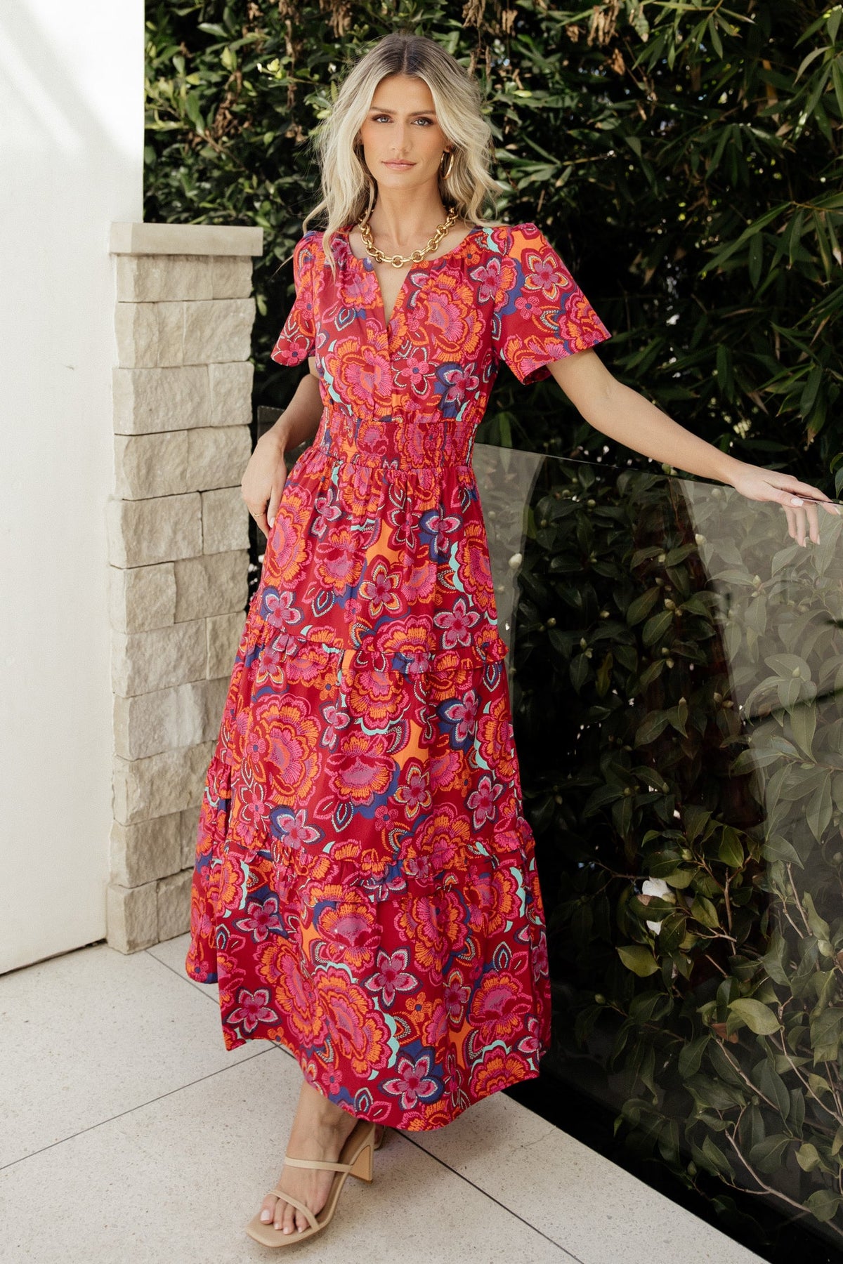 Front view of Palmer Tiered Maxi Dress in multi floral print, showing deep V-neckline, short sleeves, and smocked waist for a flattering silhouette.