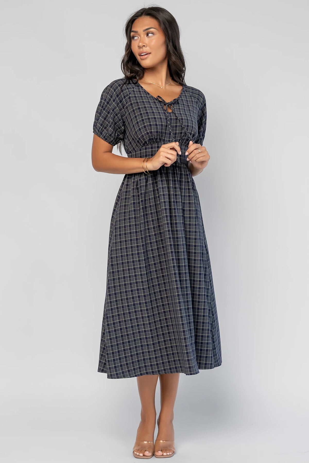 Rosalyn Midi Dress in Navy Plaid with V-neckline, adjustable bust tie, underbust panel, and midi skirt.