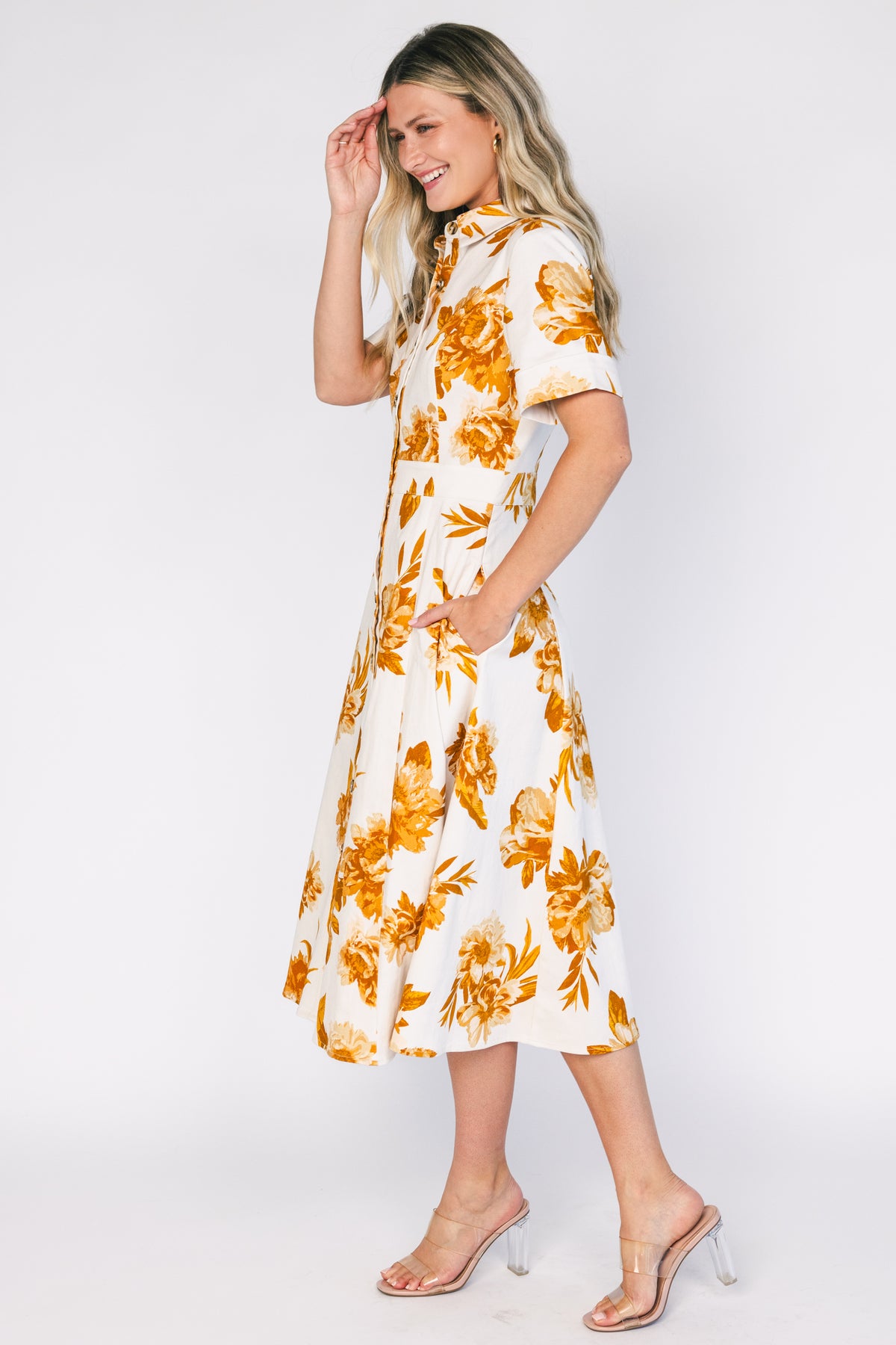 Selena Button Up Dress in Ivory + Golden Floral with collared neckline, button front, short sleeves, and fit-and-flare skirt.