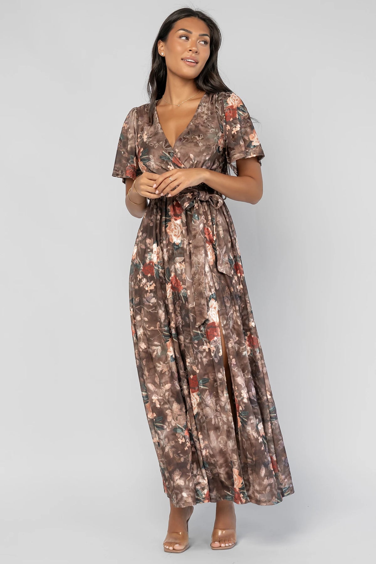 Uma Velvet Maxi Dress in Brown Floral with a burnout mesh overlay, crossover V-neckline, and a side leg slit.