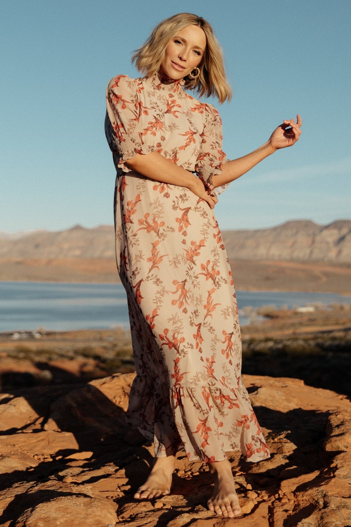 Styled look of blush floral chiffon maxi dress paired with neutral accessories, highlighting modest silhouette and occasion-ready design.