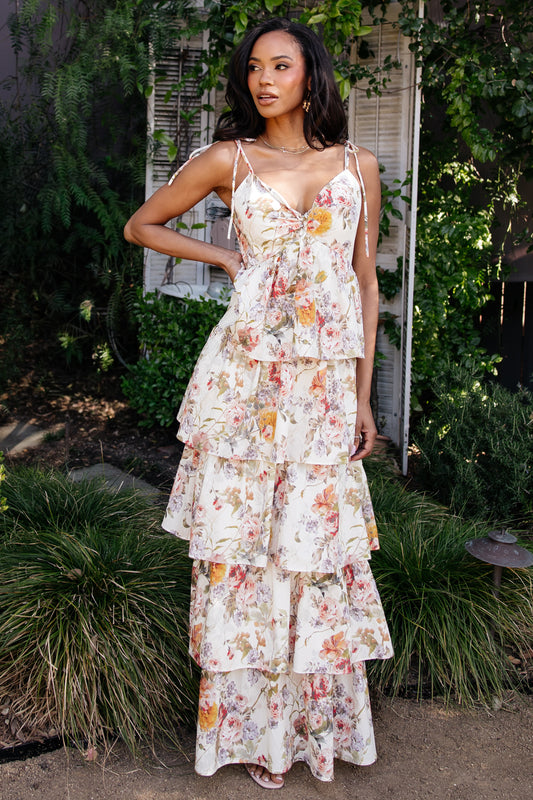 Back view showing smocked back and adjustable straps on the Angelica Tiered Maxi Dress in buttercream multi floral, lined through the final tier.