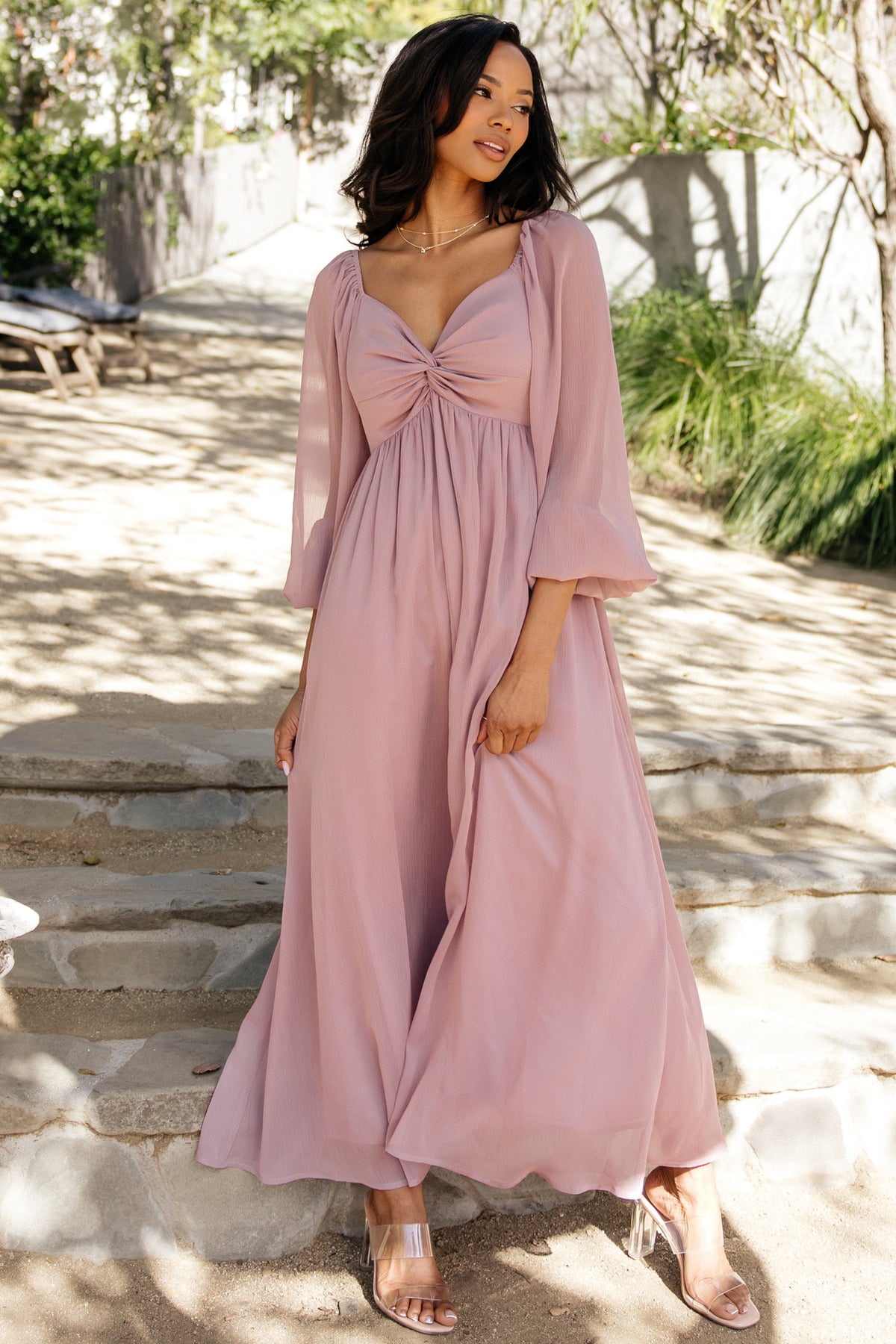 Back view of Dione Midi Dress in dusty lilac showing smocked back detail and gently gathered skirt with graceful drape.