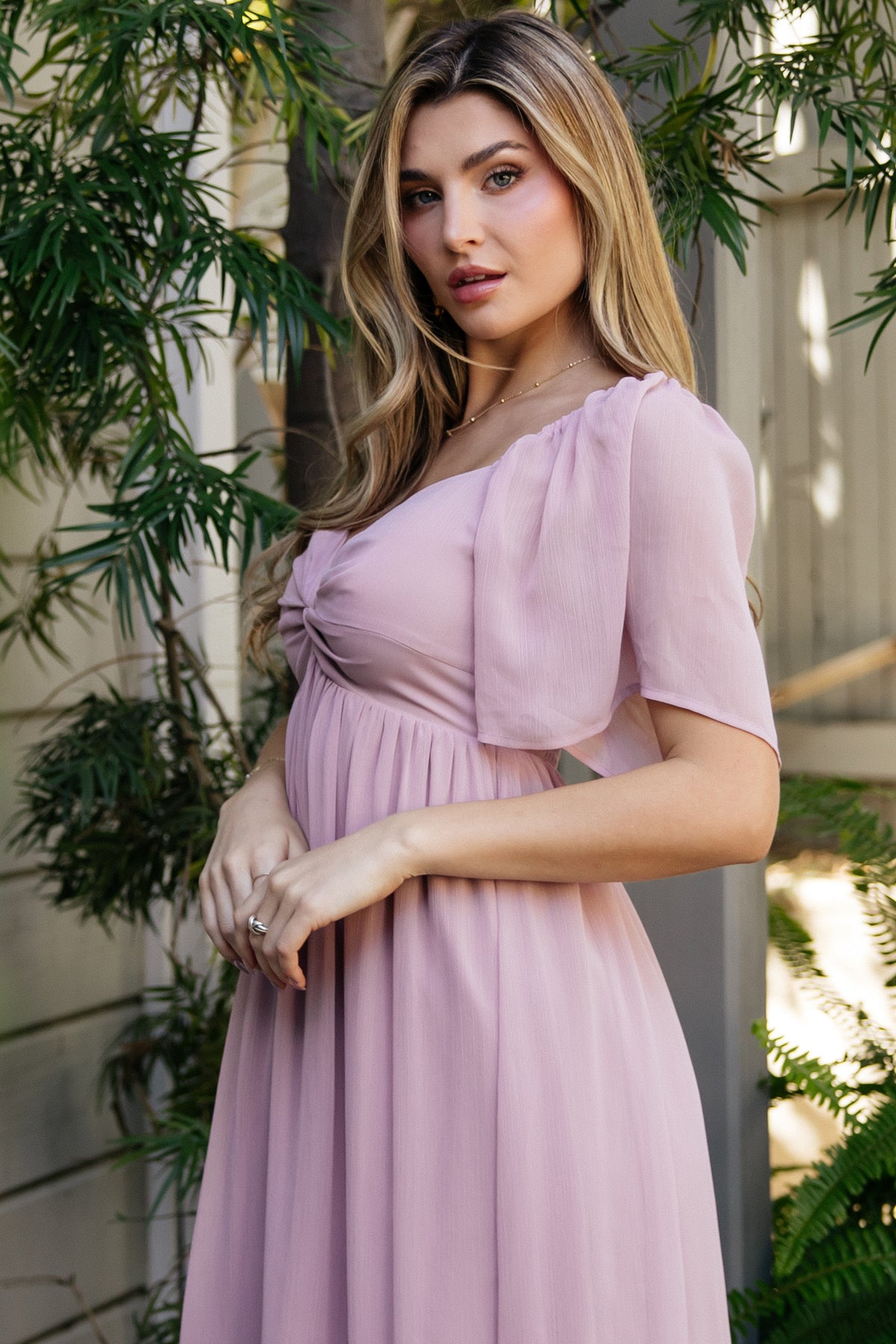 Back detail of Nora Midi Dress showing smocked back panel and gentle gathers for a comfortable, adjustable fit in dusty mauve.
