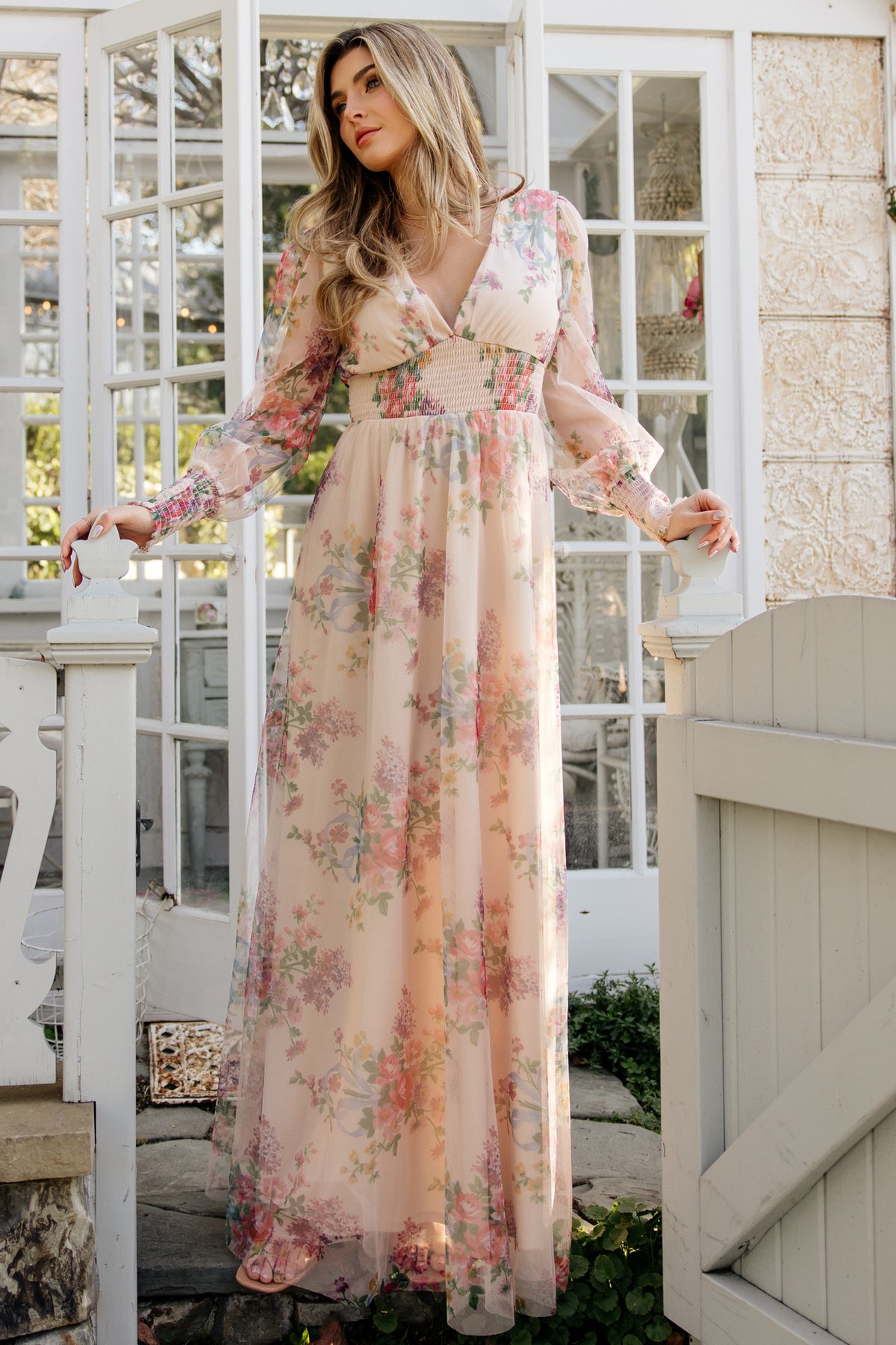 Front view of Layla Tulle Maxi Dress in Romantic Floral; model standing with flowing tulle overlay, deep V-neck, and smocked long sleeves, showcasing full-length silhouette.