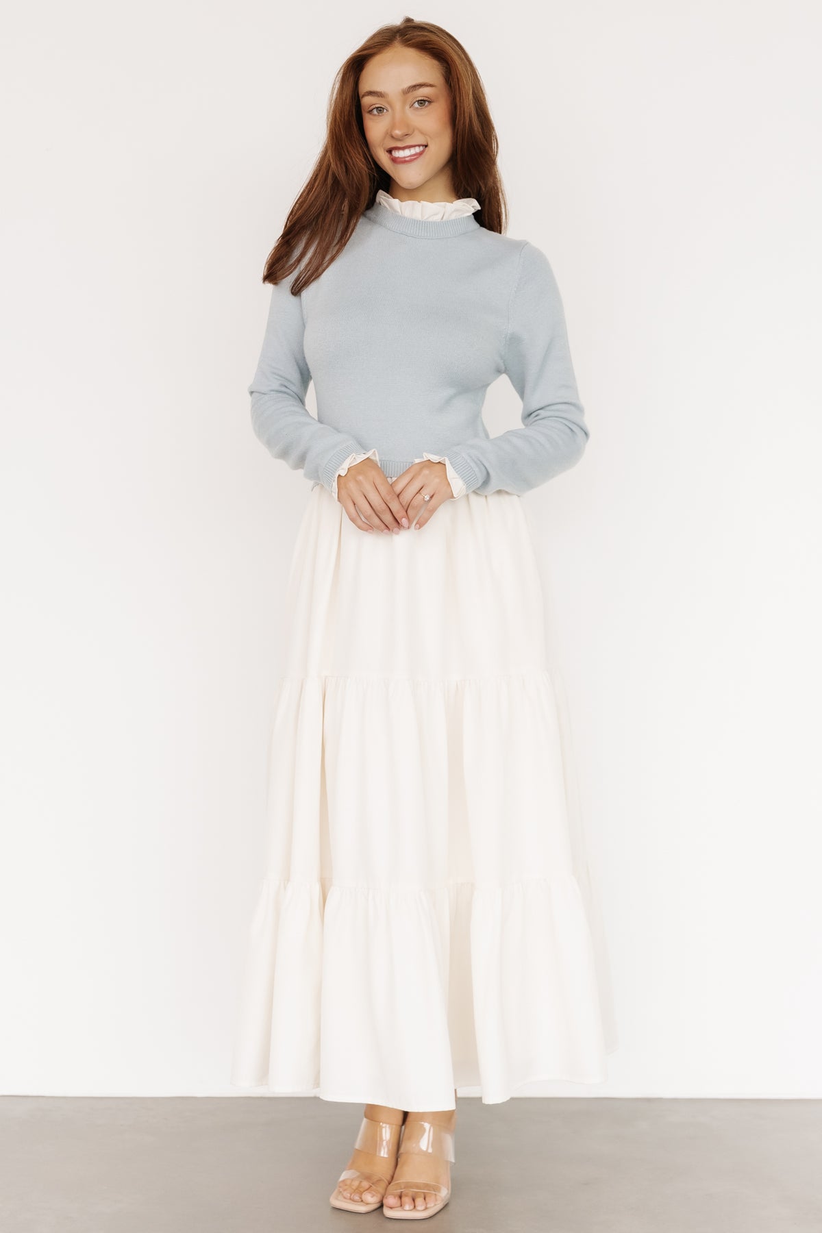 Detail shot of tiered skirt and hem movement on the Light Blue & Ivory Sophie Sweater Dress, showing full lining and fabric drape.