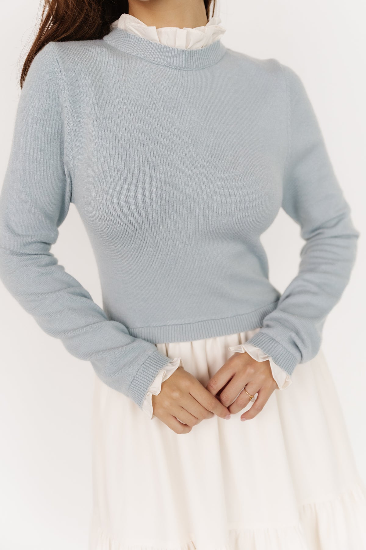 Full-length image of light blue and ivory Sophie Sweater Dress highlighting three-tier skirt, flowing silhouette, and soft sweater-knit bodice.