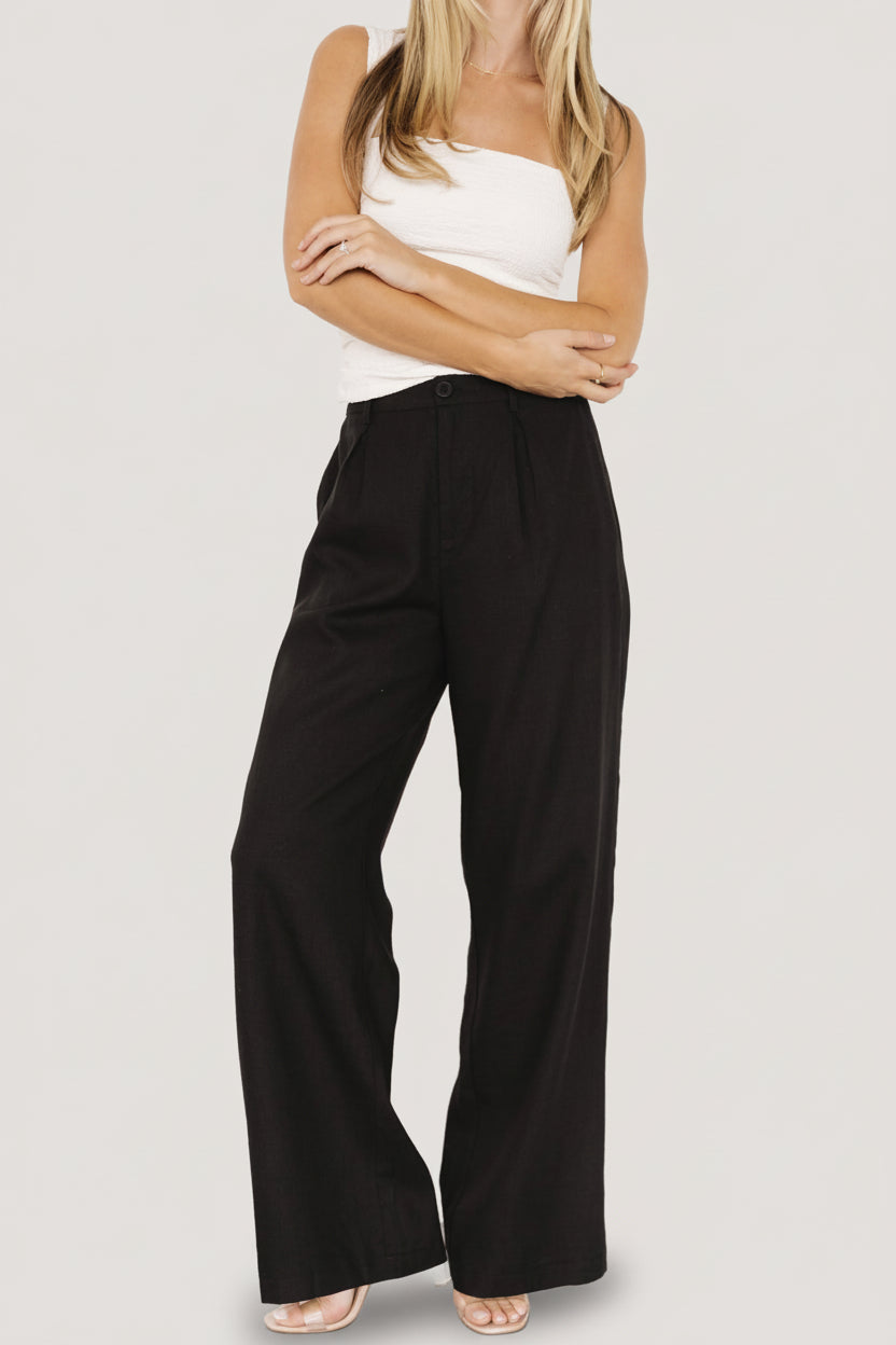 Styled outfit photo pairing Malin wide leg pants with a knit top, illustrating versatile dressing from casual to polished occasions.