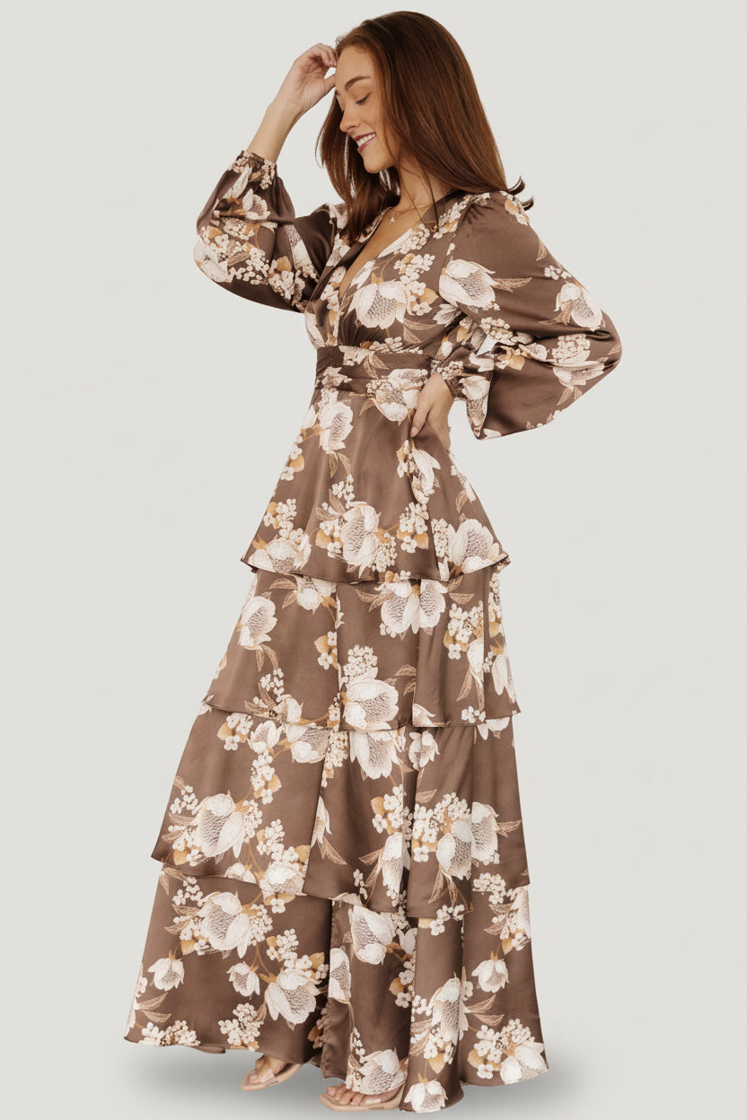 Side view highlighting the short flowy sleeve, contoured under-bust seam and the gentle drape of the fully lined satin skirt.