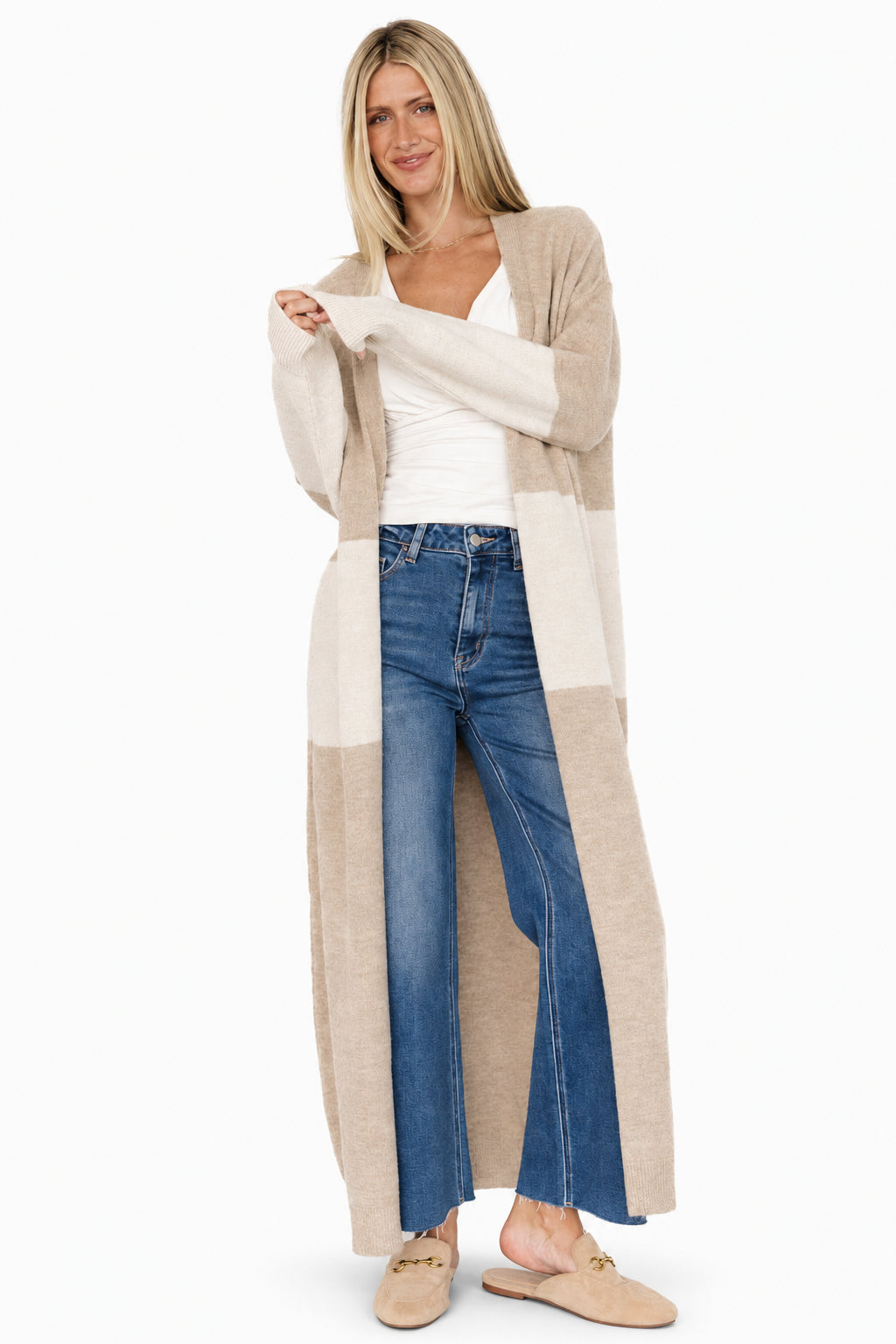 Three-quarter side view of Thea duster cardigan showing colorblock panels, longline length, and soft sweater knit texture on model.