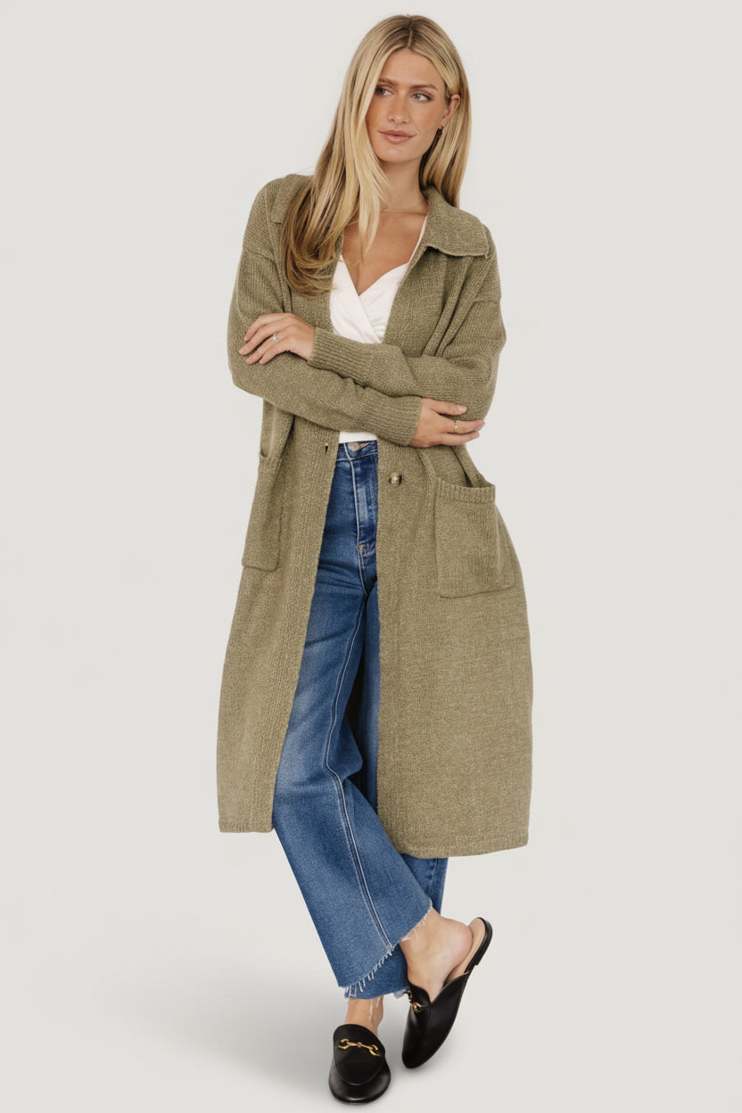 Full-length shot of the heathered olive longline cardigan on model, showing overall fit, patch pockets, and two-button waist.