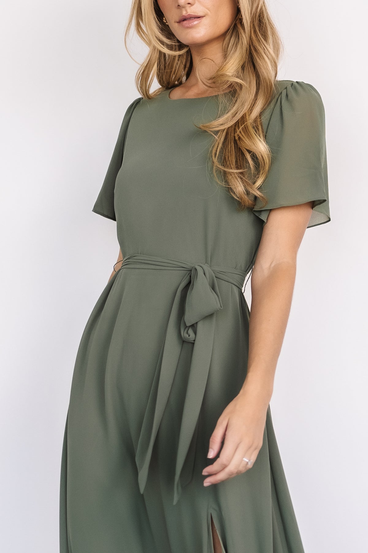 Back detail of Naomi maxi dress in dark sage showing keyhole button closure at the neck and elasticized back waist for adjustable fit.