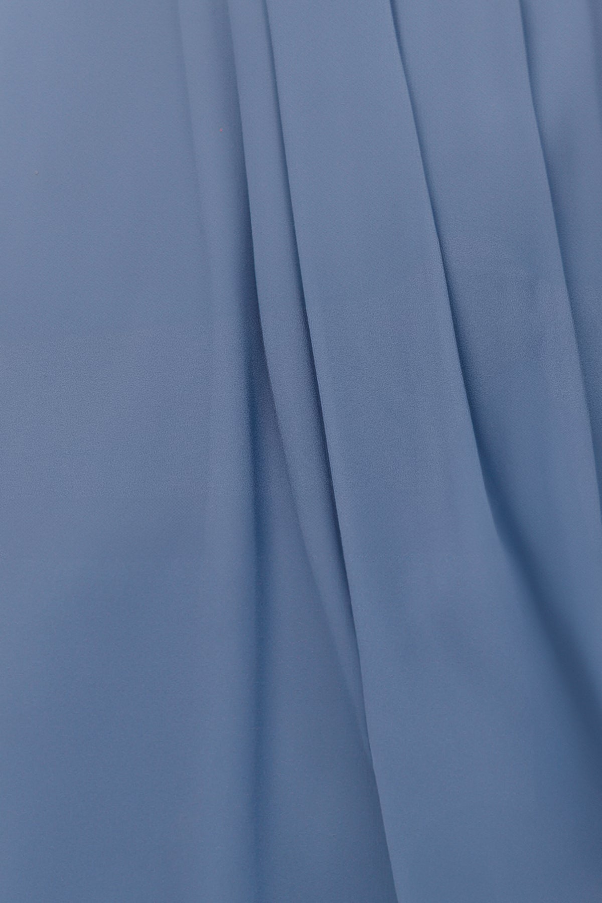Whisper Blue Kia chiffon fabric swatch on white background showing lightweight, semi-sheer texture and soft drape for color evaluation.