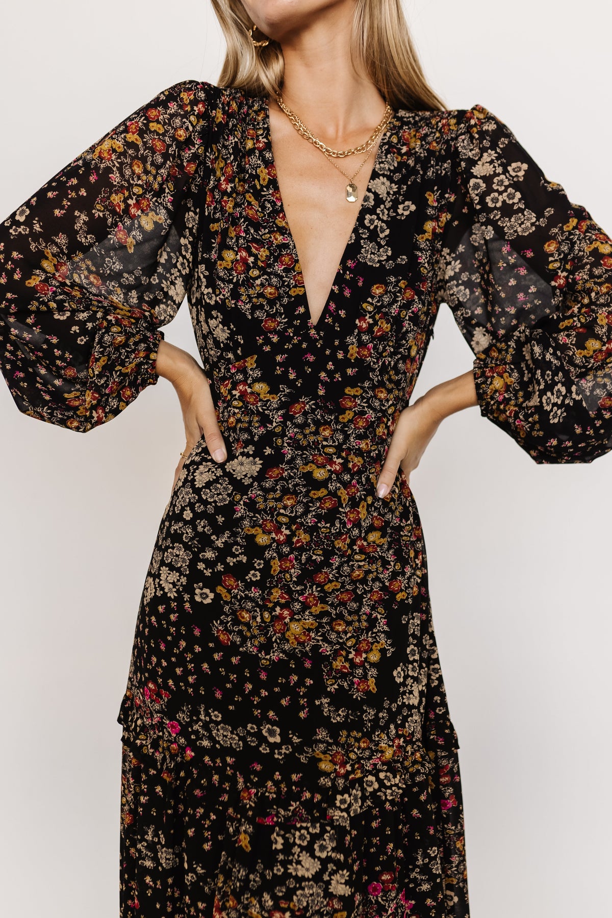 Bowman Deep V Tiered Maxi Dress in Black Multi with deep V-neck, long sleeves, ruffle-tiered skirt, and leg slit.