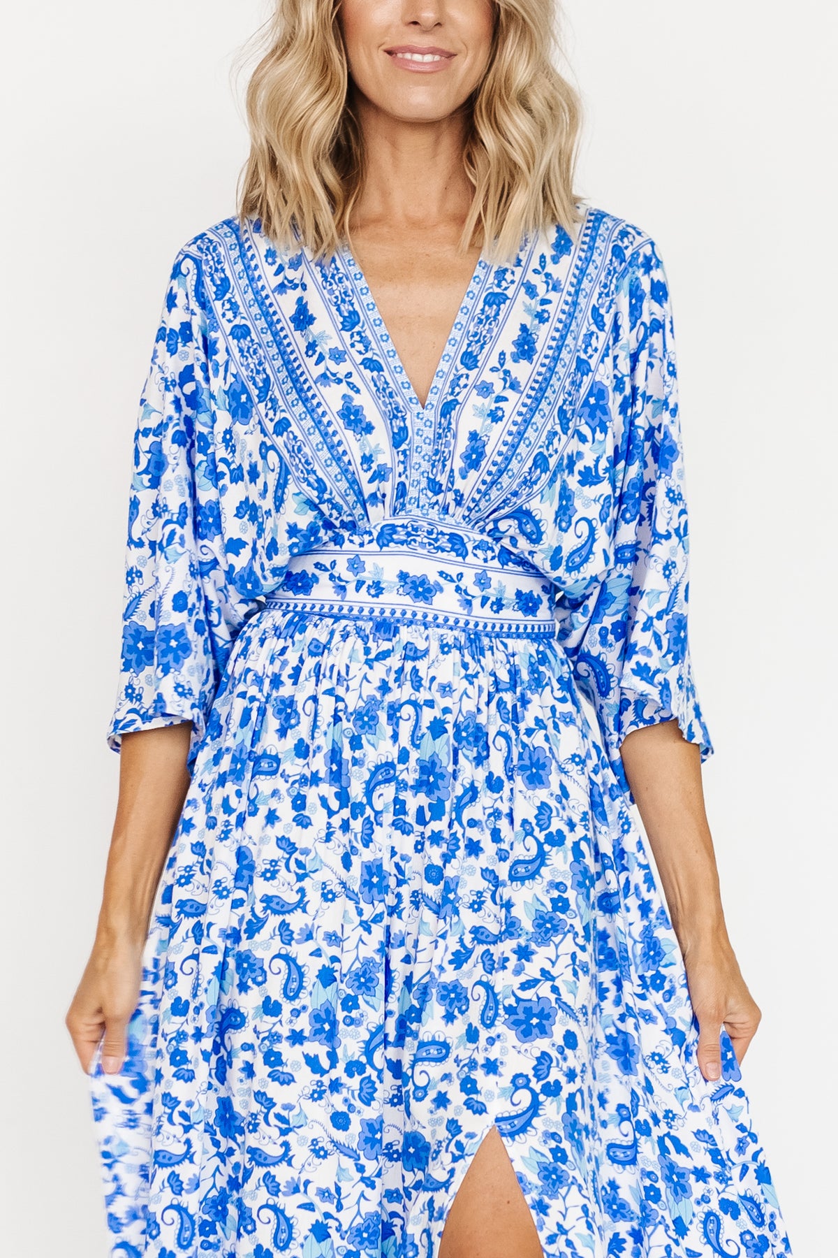 Back view showing V-back and attached waist tie with elastic back waist on blue and white Watson kimono maxi dress.