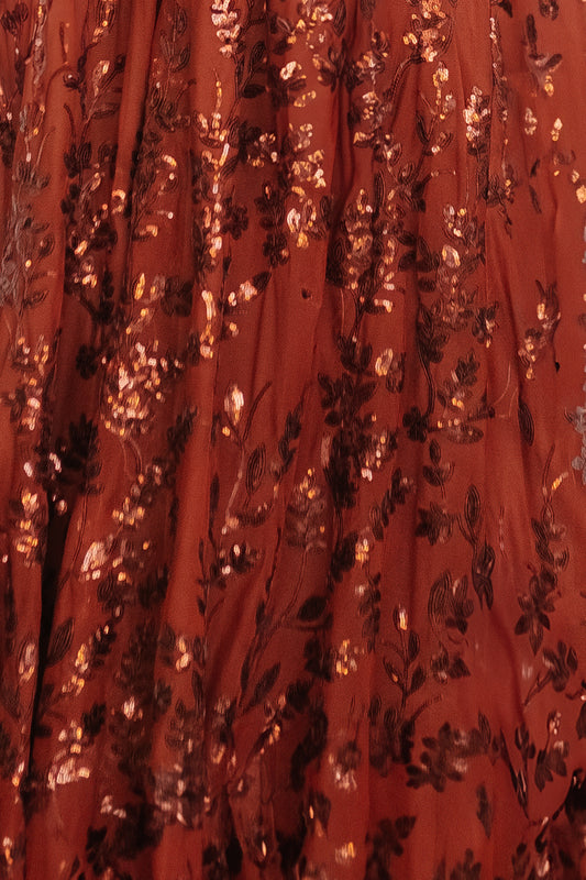 Close-up of cinnamon Destiny Sequin fabric swatch on white card, showing dense sequins and textured base (approx. 3×4 in)