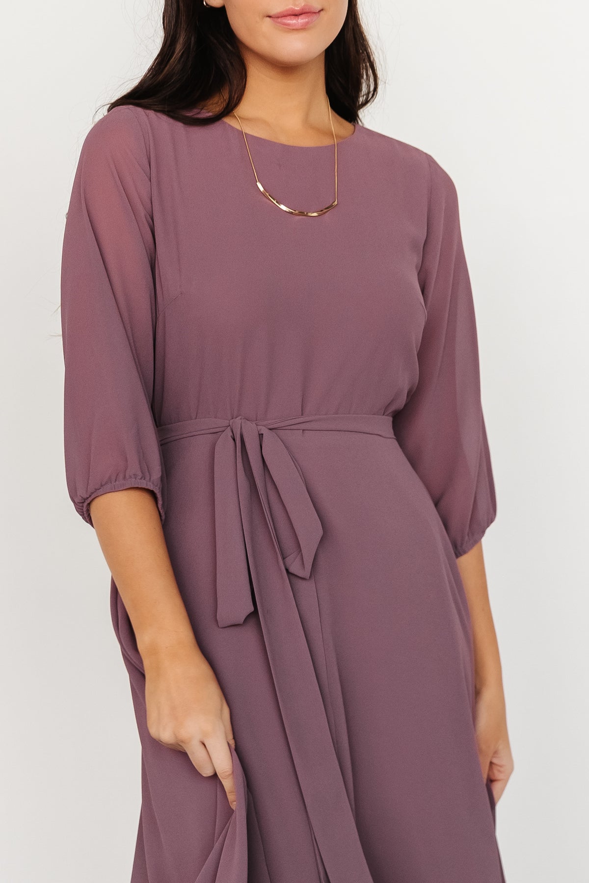 Detail shot of Rebecca Maxi Dress fabric and stitching, showing chiffon texture and lining contrast.