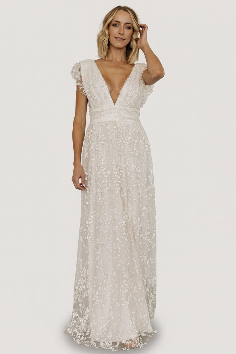 Front view of Arlene Shimmer Maxi Gown in ivory with deep V-front, high banded waist, and shimmering floral tulle overlay.