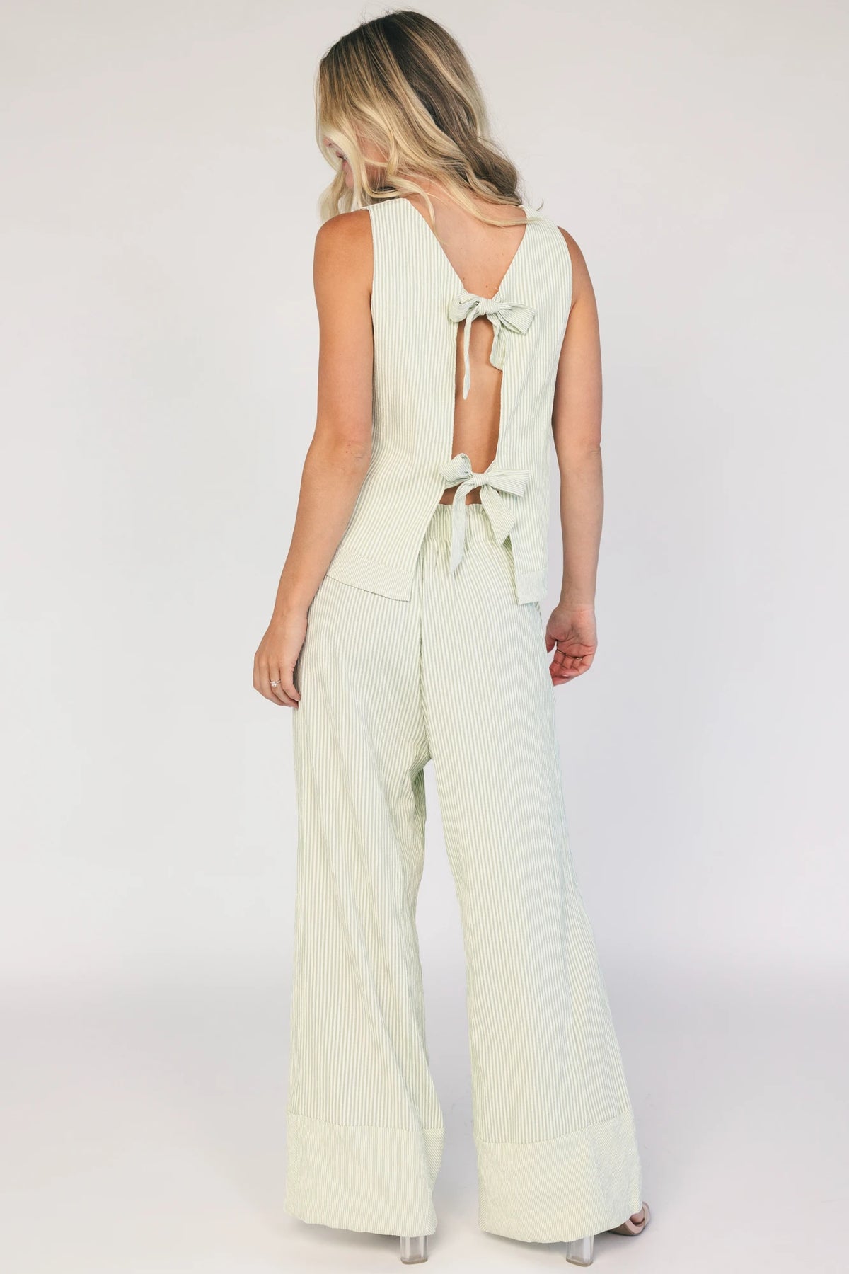 Sage striped matching set with a sleeveless open-back tie top, wide-leg pants, smocked waistband, side pockets, and a relaxed fit.