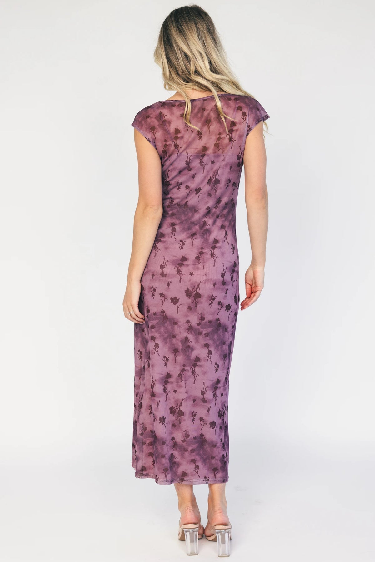 Model wearing a dusty plum floral mesh midi dress with a round neckline, short sleeves, and a fitted bodycon silhouette.