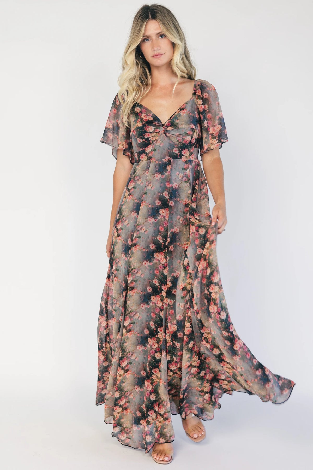 Positano Maxi Dress in Multi Floral with sweetheart neckline, flutter sleeves, smocked back, and flowy tiered skirt.