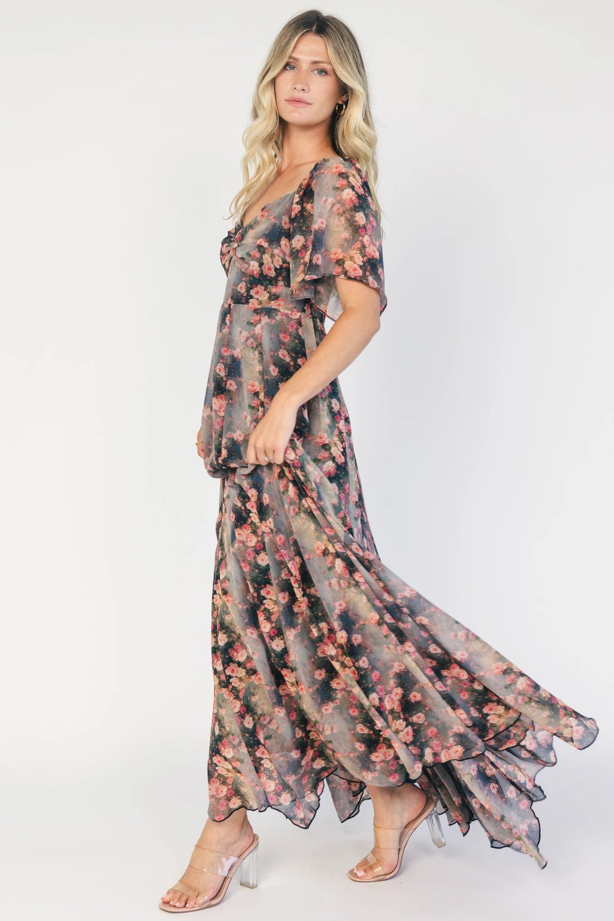 Positano Maxi Dress in Multi Floral with sweetheart neckline, flutter sleeves, smocked back, and flowy tiered skirt.