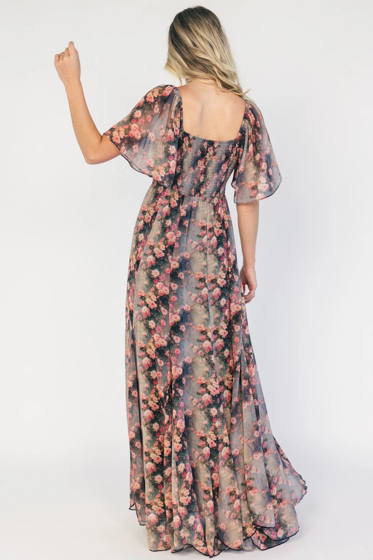 Positano Maxi Dress in Multi Floral with sweetheart neckline, flutter sleeves, smocked back, and flowy tiered skirt.