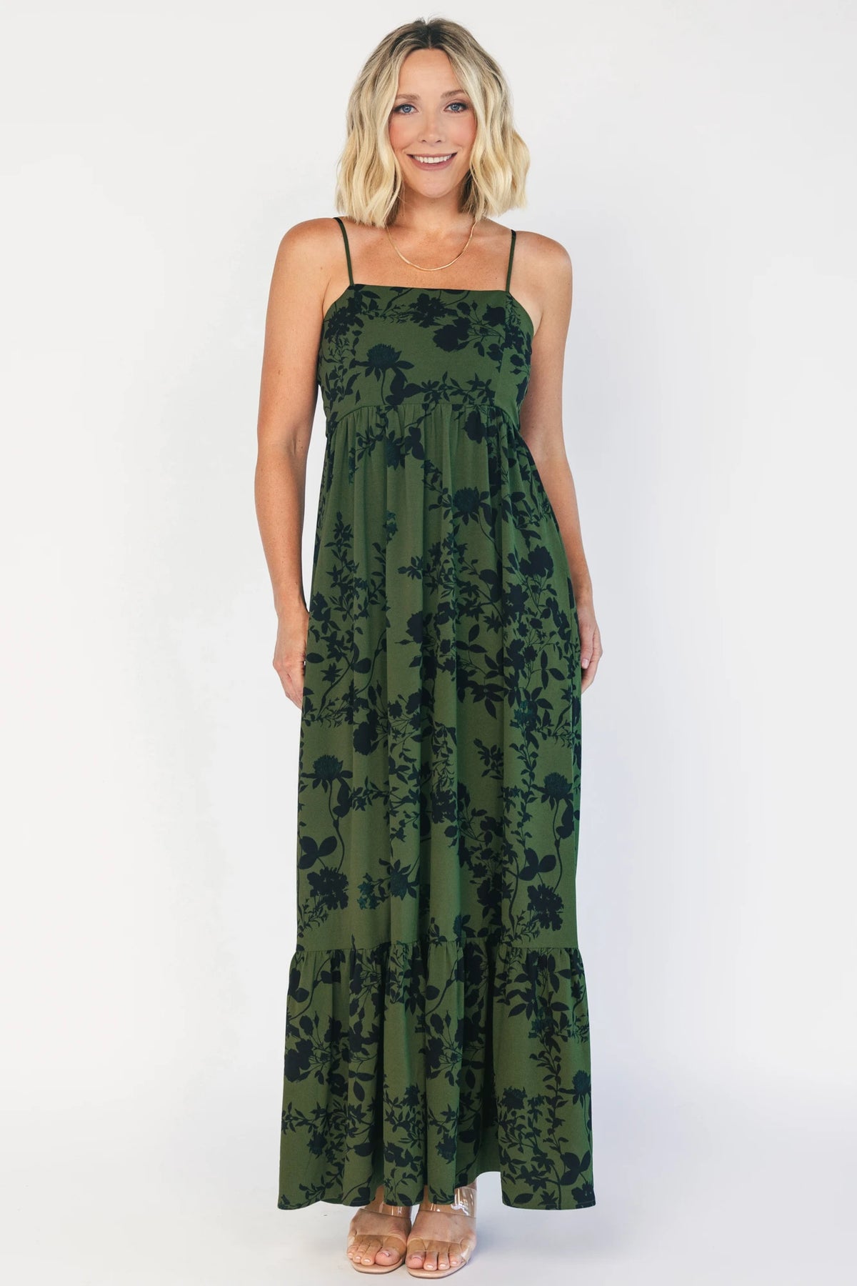 Rowan Tank Maxi Dress in Deep Olive with floral print, adjustable straps, smocked back, sash tie, and tiered skirt.
