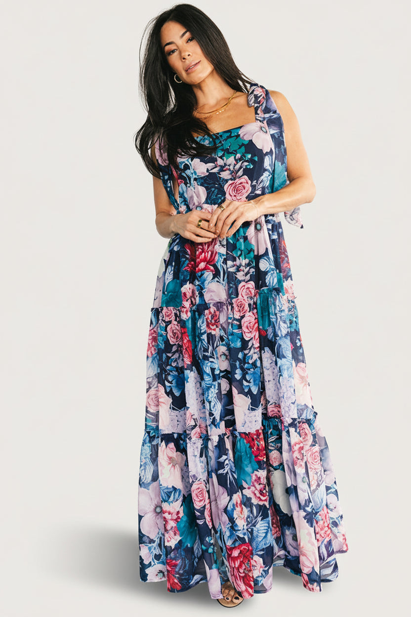 Side view of Anita Maxi Dress highlighting three-tier ruffled skirt, flowing chiffon overlay, and flattering paneled front bodice.