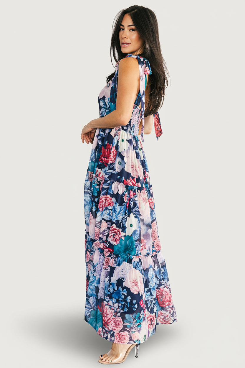 Close-up of Anita Maxi Dress fabric and print: dark blue base with pink and blue floral motifs and delicate chiffon texture.