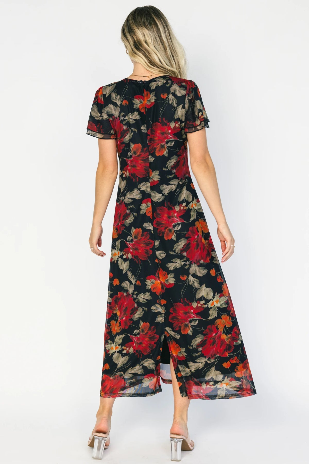 Black floral mesh maxi dress with a round neckline, layered flutter sleeves, bias-cut silhouette, and flowing full-length skirt.