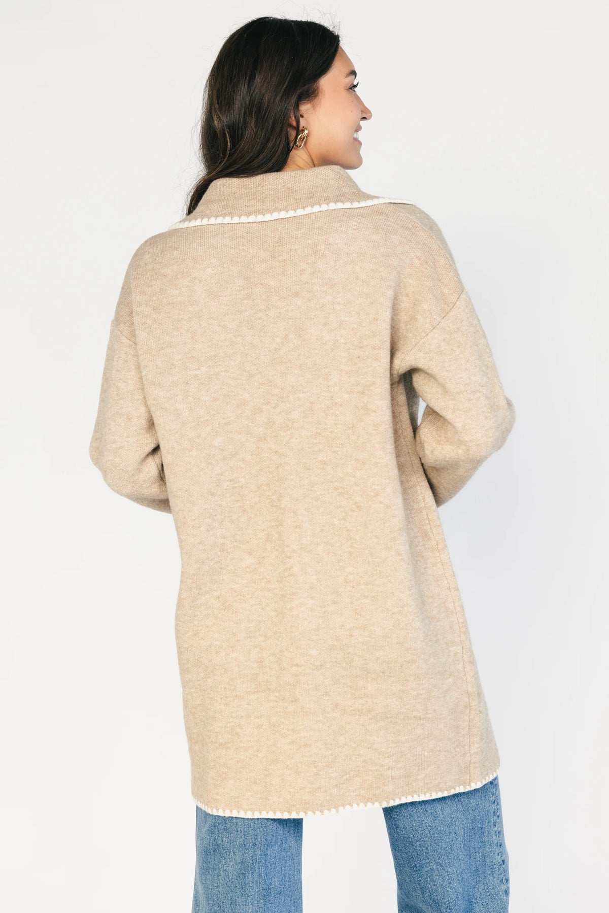 Taupe collared knit cardigan with cream contrast trim, a button-front closure, long sleeves, and two front patch pockets in a relaxed, shirt-style silhouette.