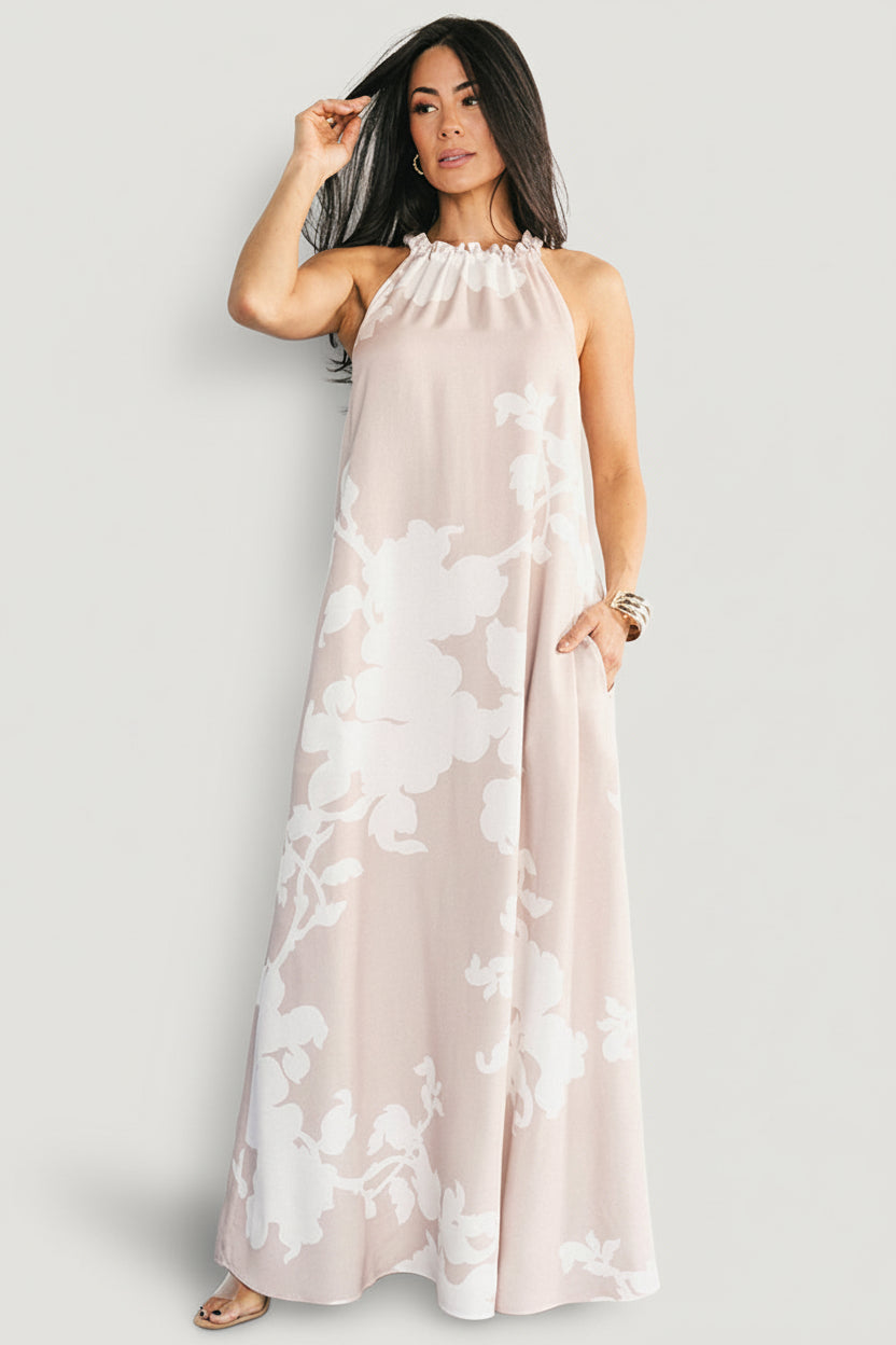 Front view of the Aurelia Halter Column Maxi Dress in natural with white print, showing halter neckline and column silhouette.