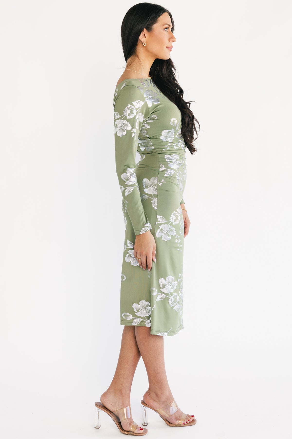 Back view of Valeria Midi Dress in sage with scoop back and hidden back zipper visible on the model.